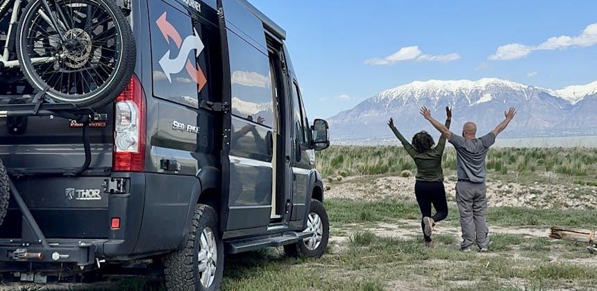 Gabe and Rocio Rivero next to their Thor Motor Coach Sequence in the mountains.