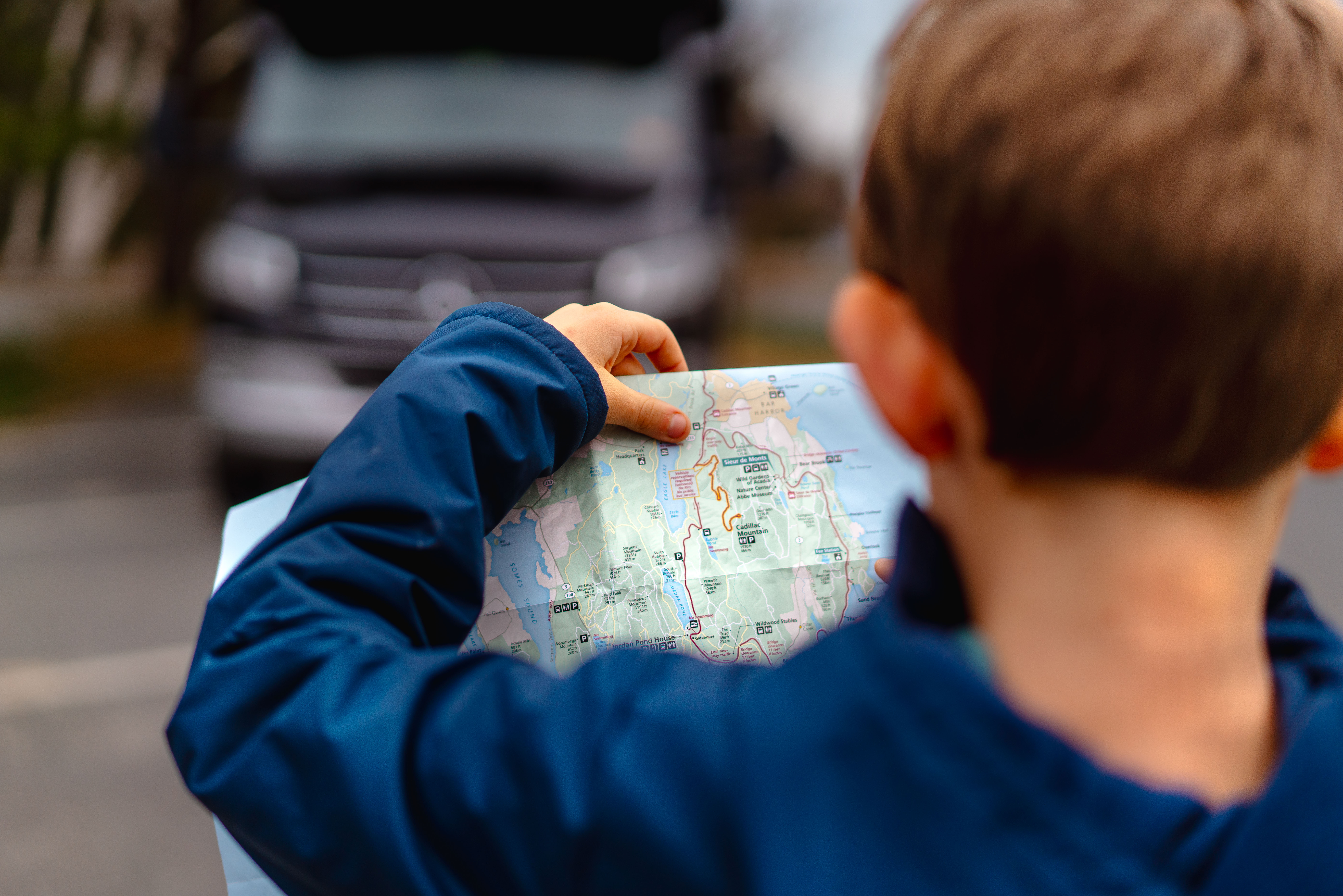 One of the Tilby kids looks at a map.