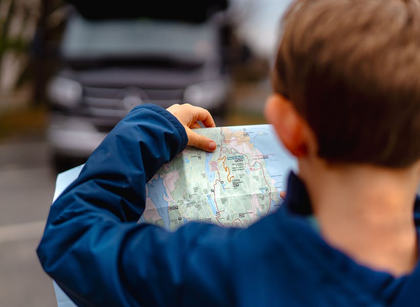 One of the Tilby kids looks at a map.