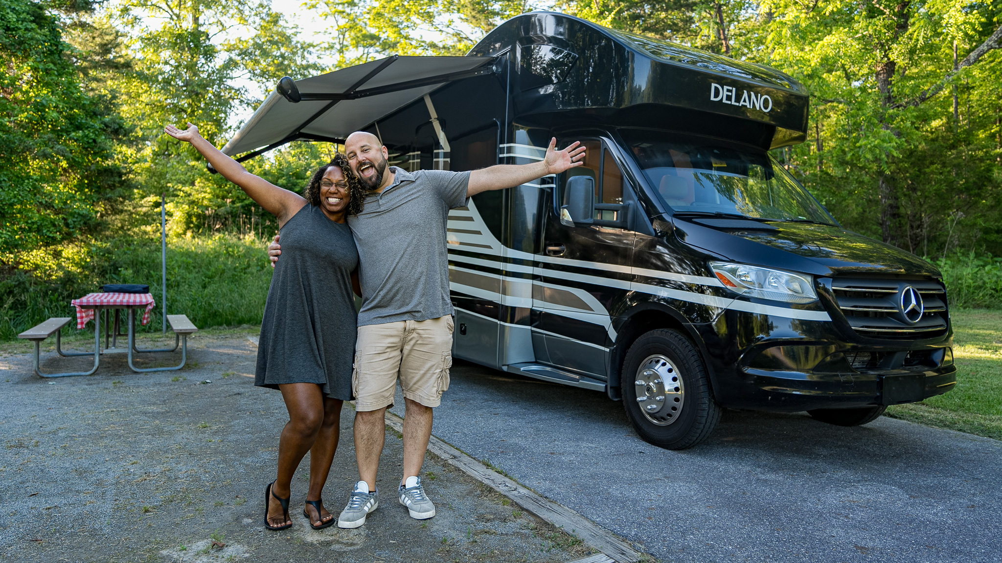 Gabe and Rocio Rivero pose in front of their Thor Motor Coach Delano Class C Motorhome.