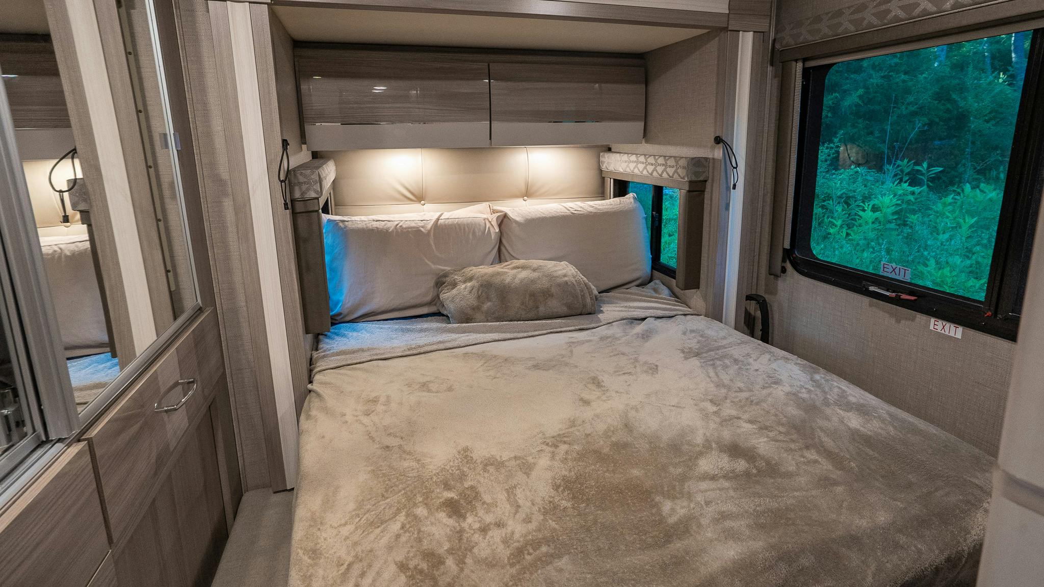 The bedroom inside the Rivero's Thor Motor Coach Delano Class C Motorhome.