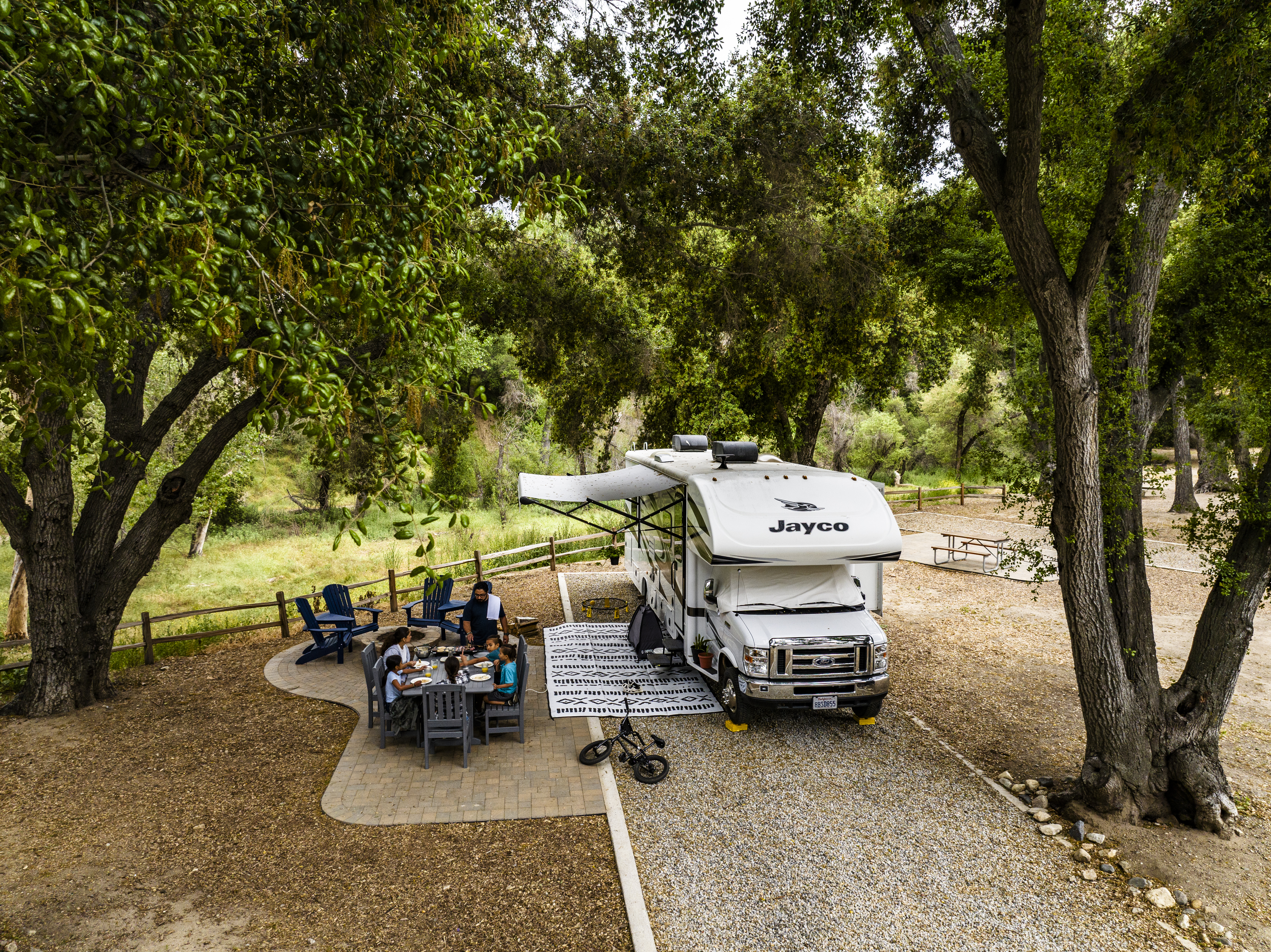 The Peña family's Jayco Greyhawk Class C Motorhome at a campsite at KOA.