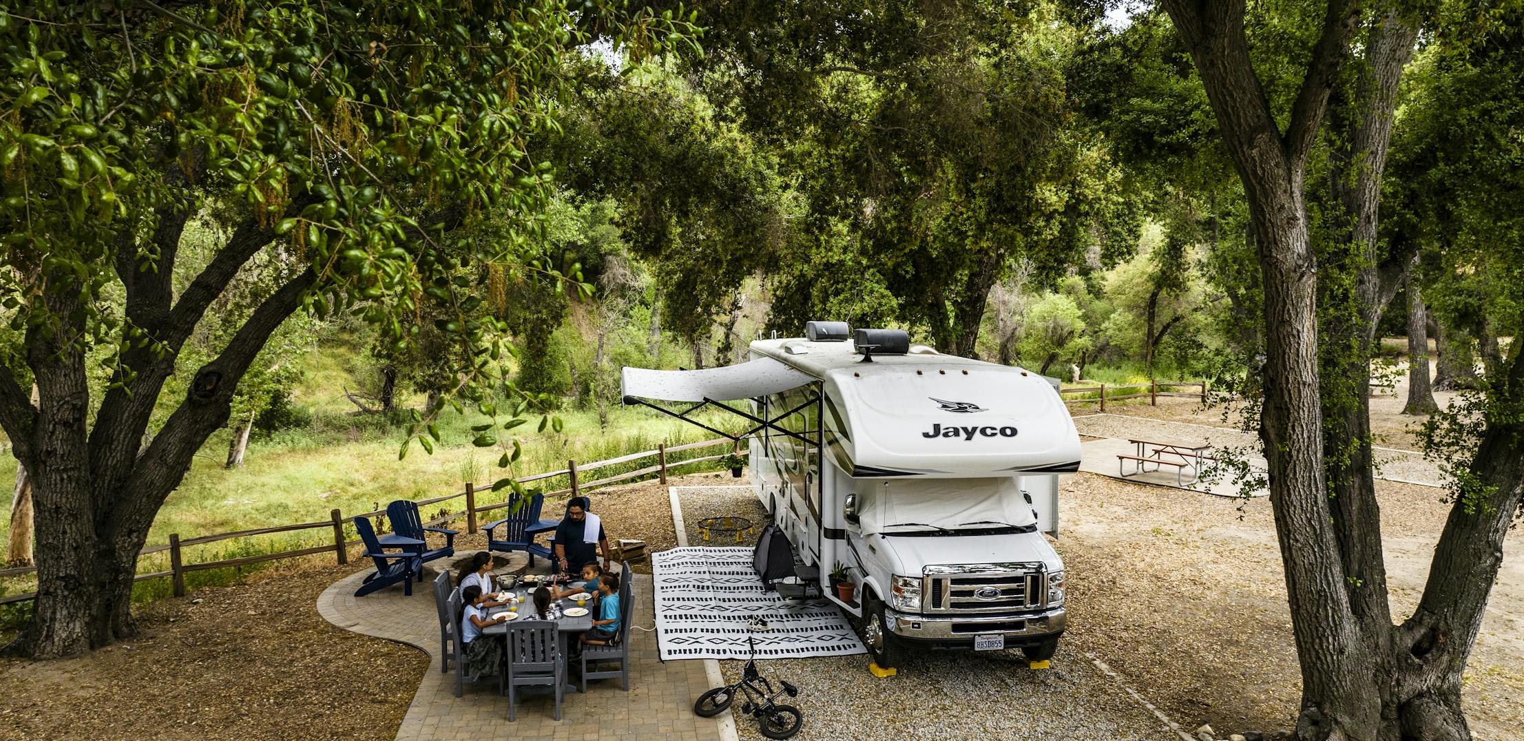 The Peña family's Jayco Greyhawk Class C Motorhome at a campsite at KOA.