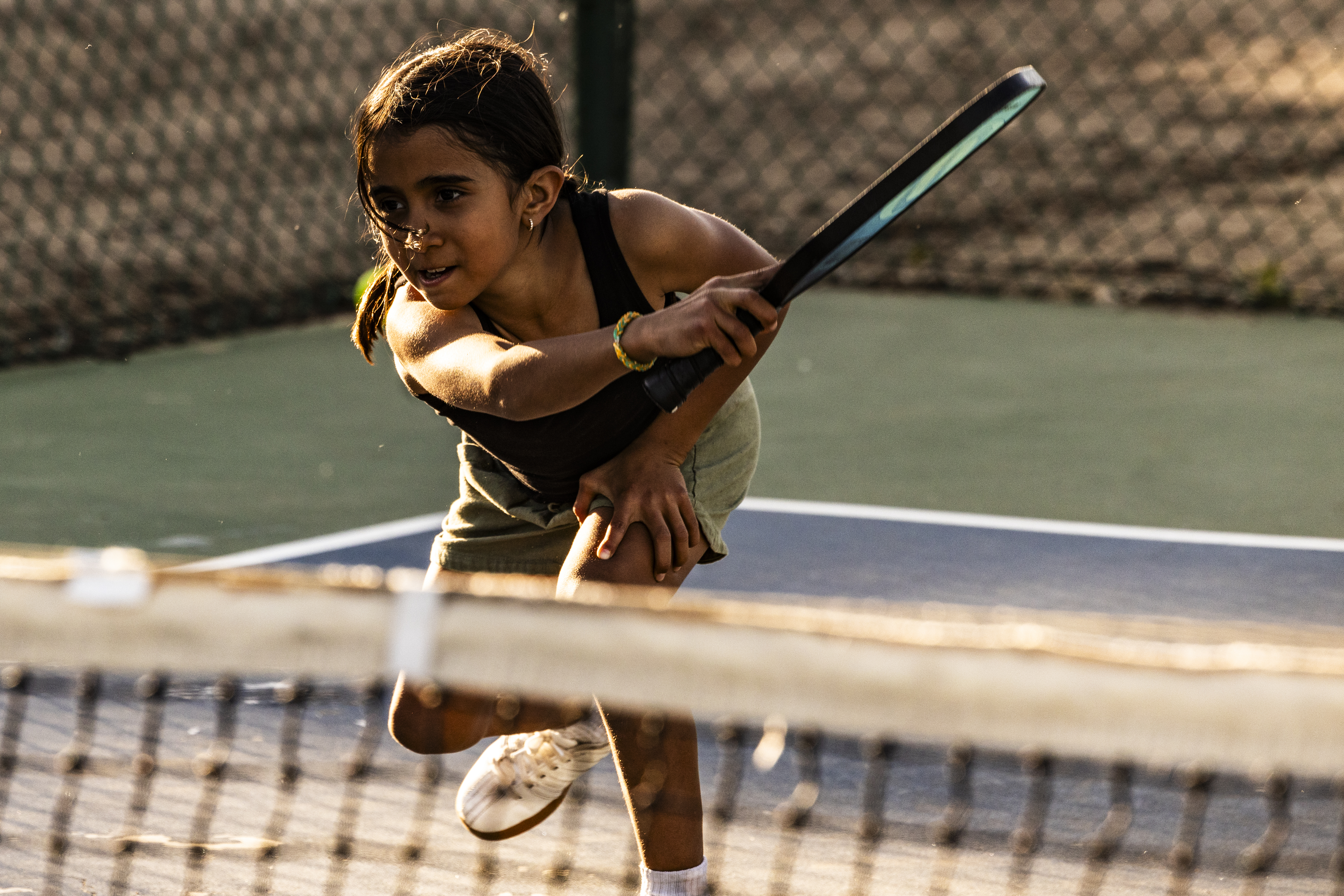 The Peña kid plays pickleball.