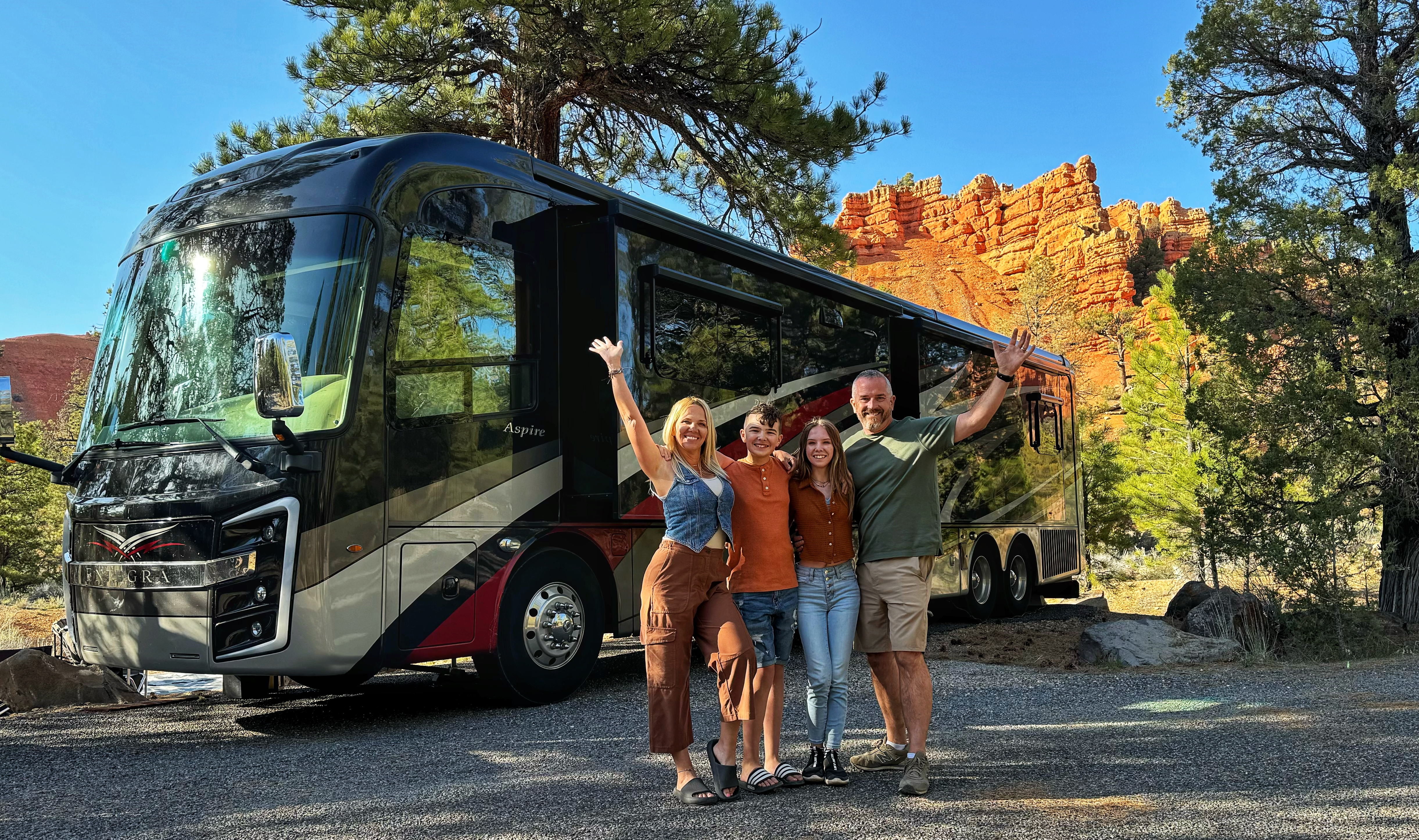 Carrie Cassity and her family pose in front of their Class A Entegra Vision motorhome.