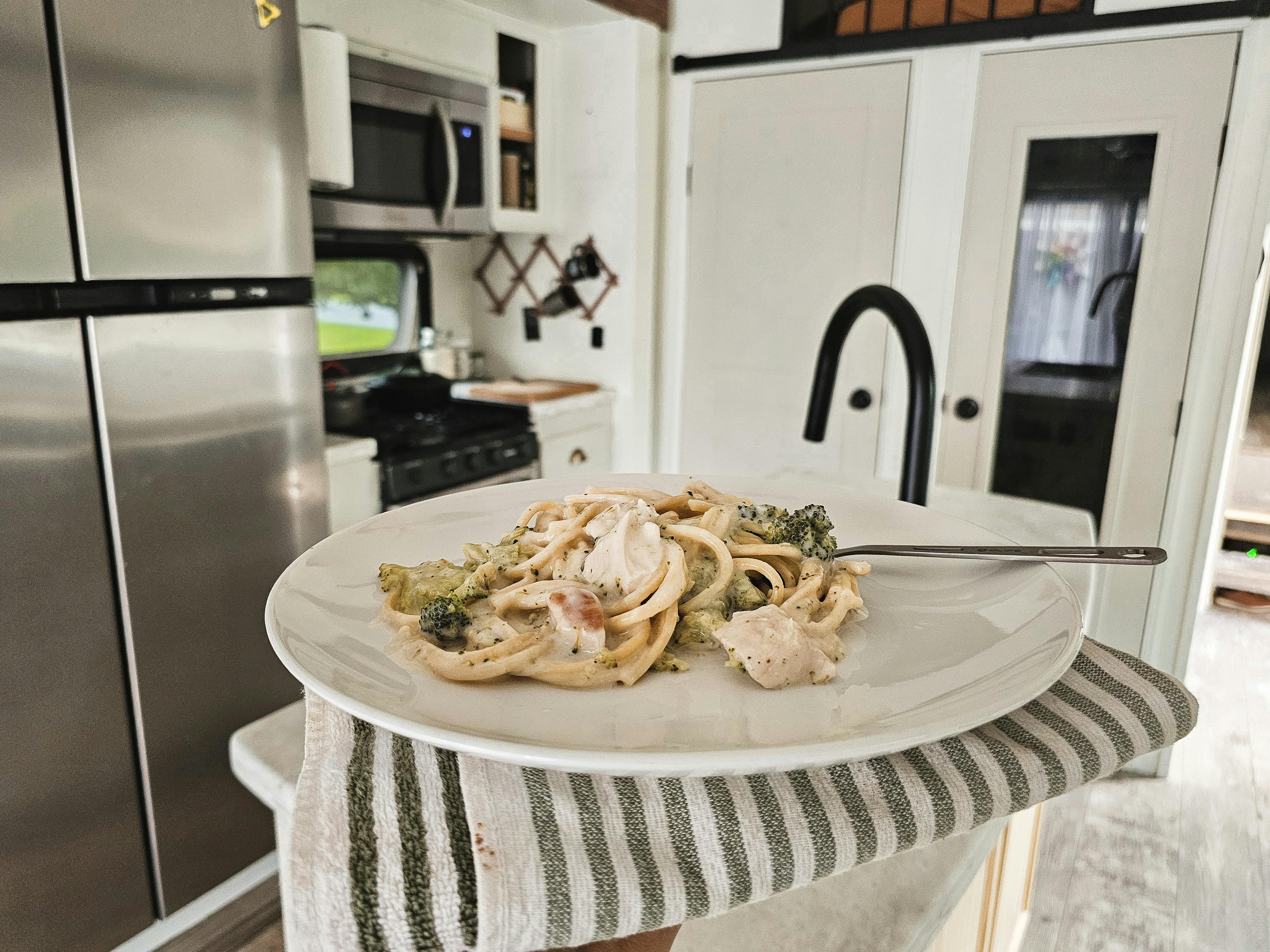 A plate of food inside Bibi Barringer's KZ Durango Gold fifth wheel.