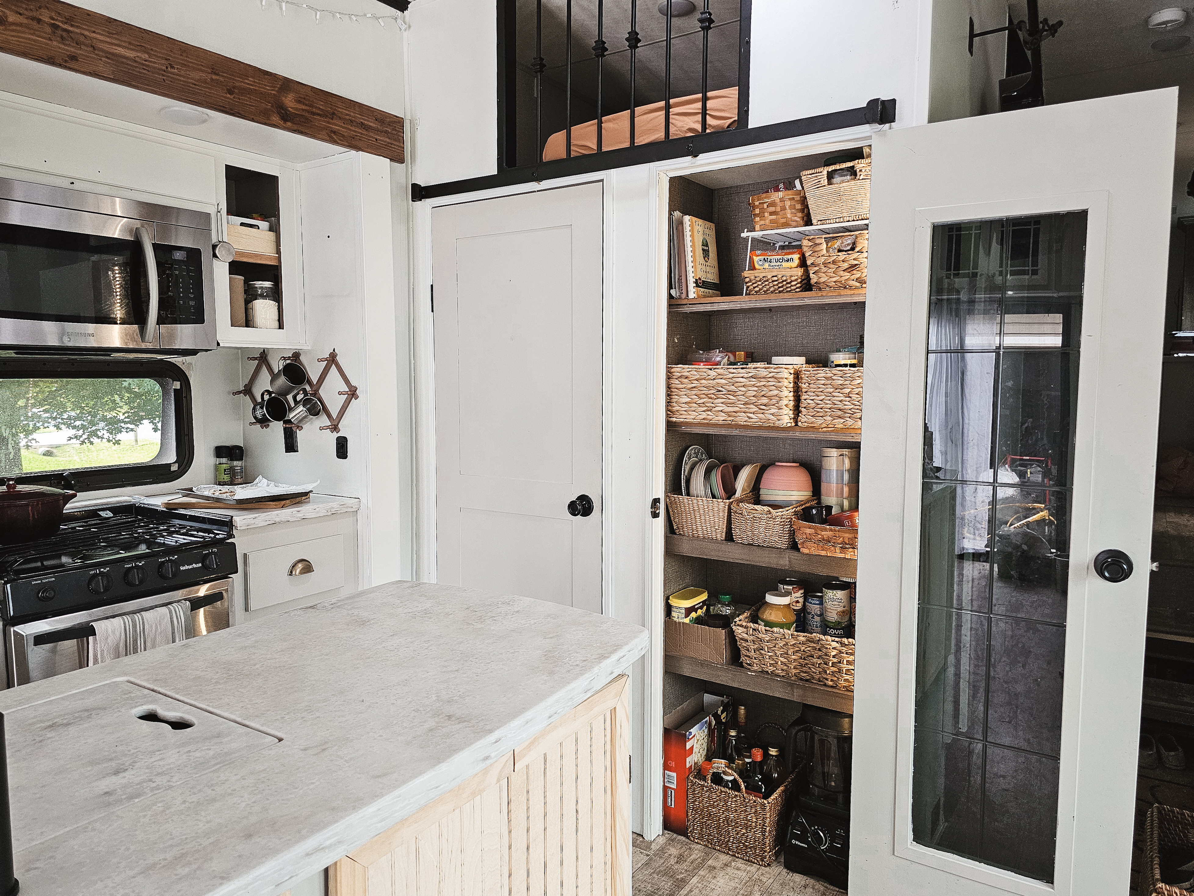 The kitchen pantry inside Bibi Barringer's KZ Durango Gold fifth wheel.