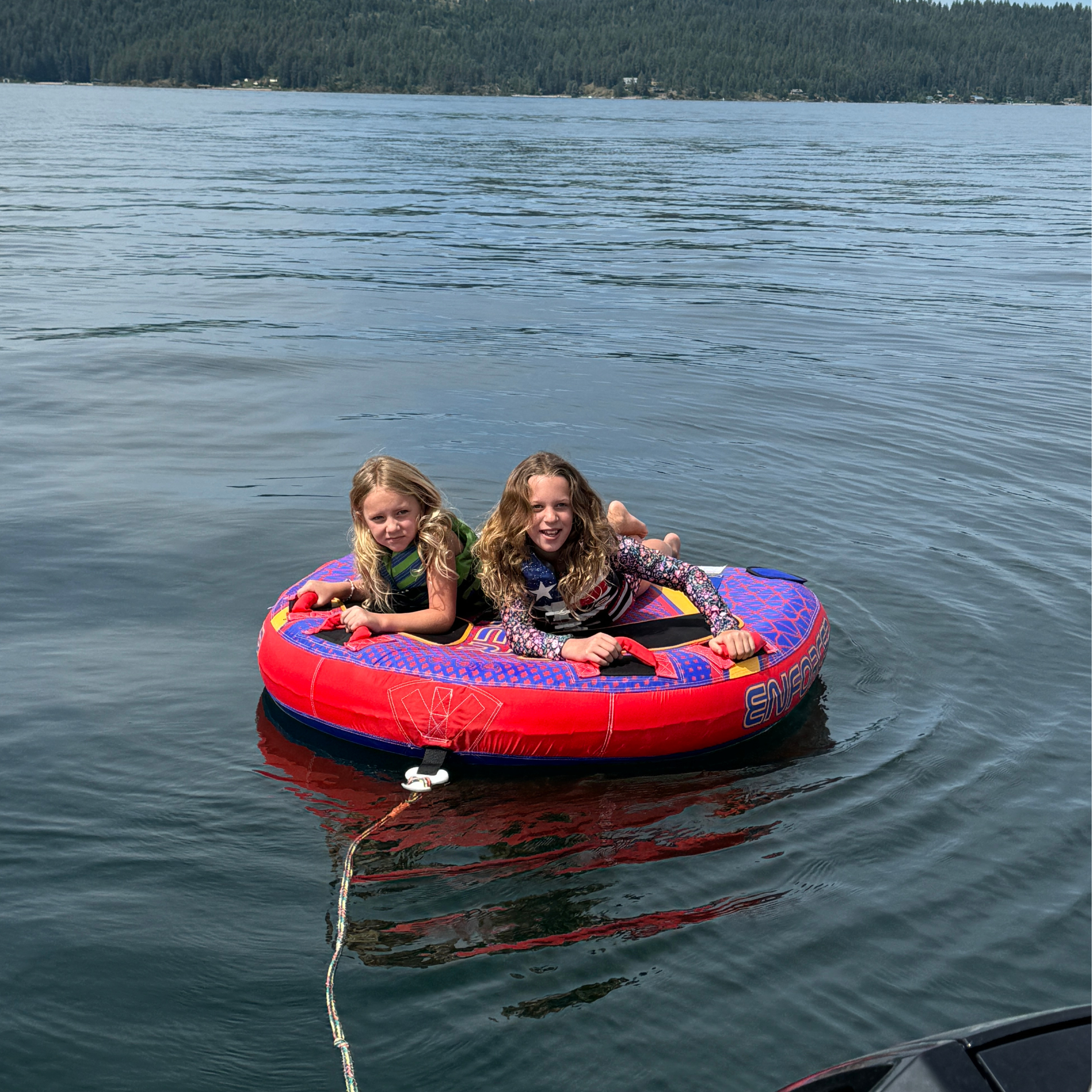Ashley Peeples' daughters ride on an inner tube.
