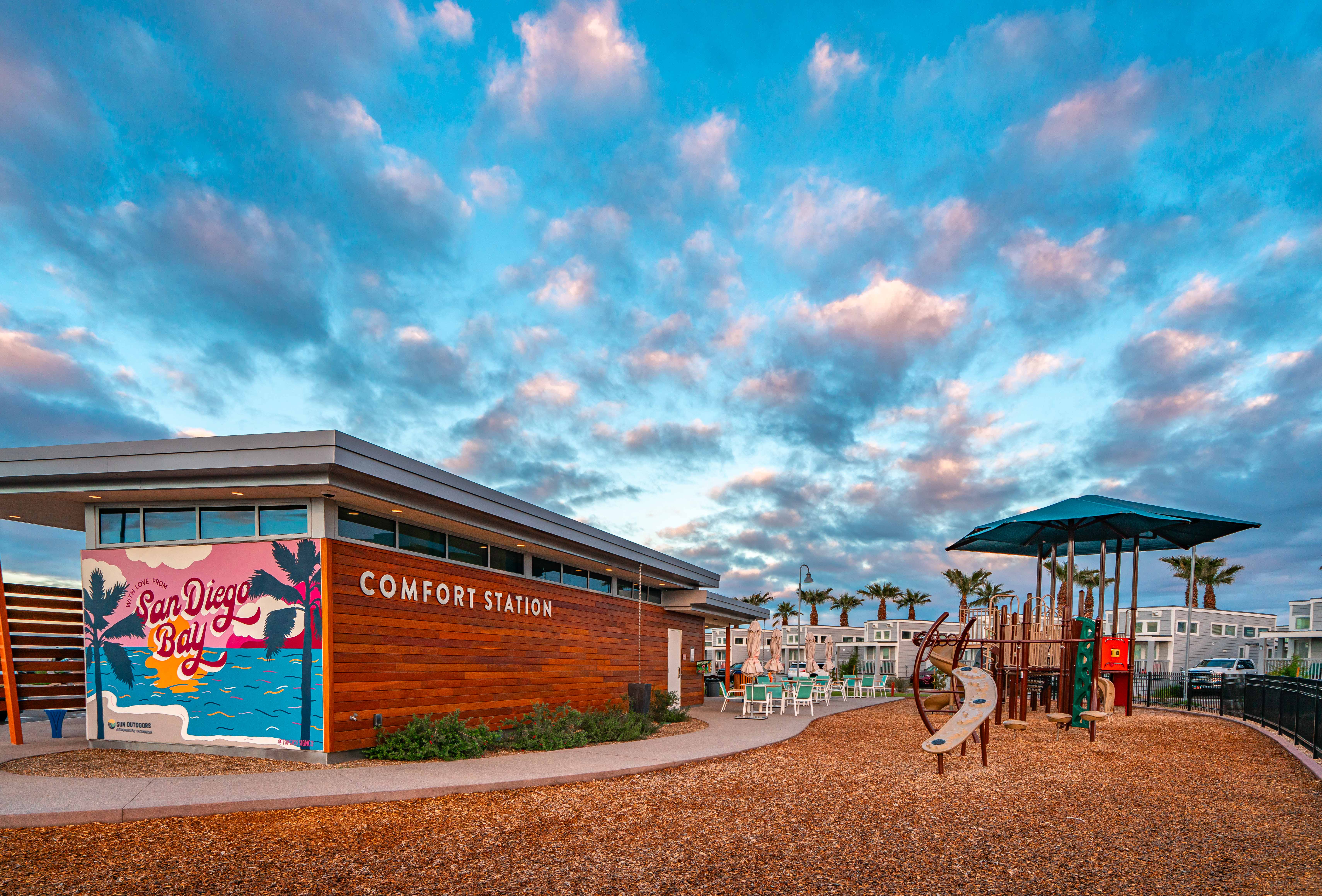 A bathroom and playground at a campground in San Diego.