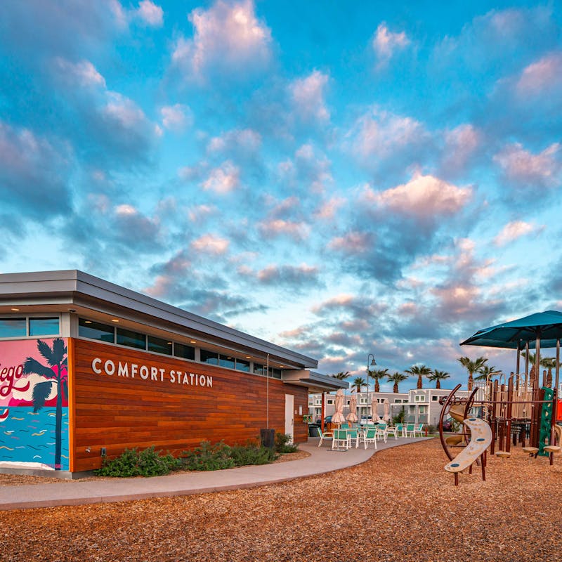 A bathroom and playground at a campground in San Diego.