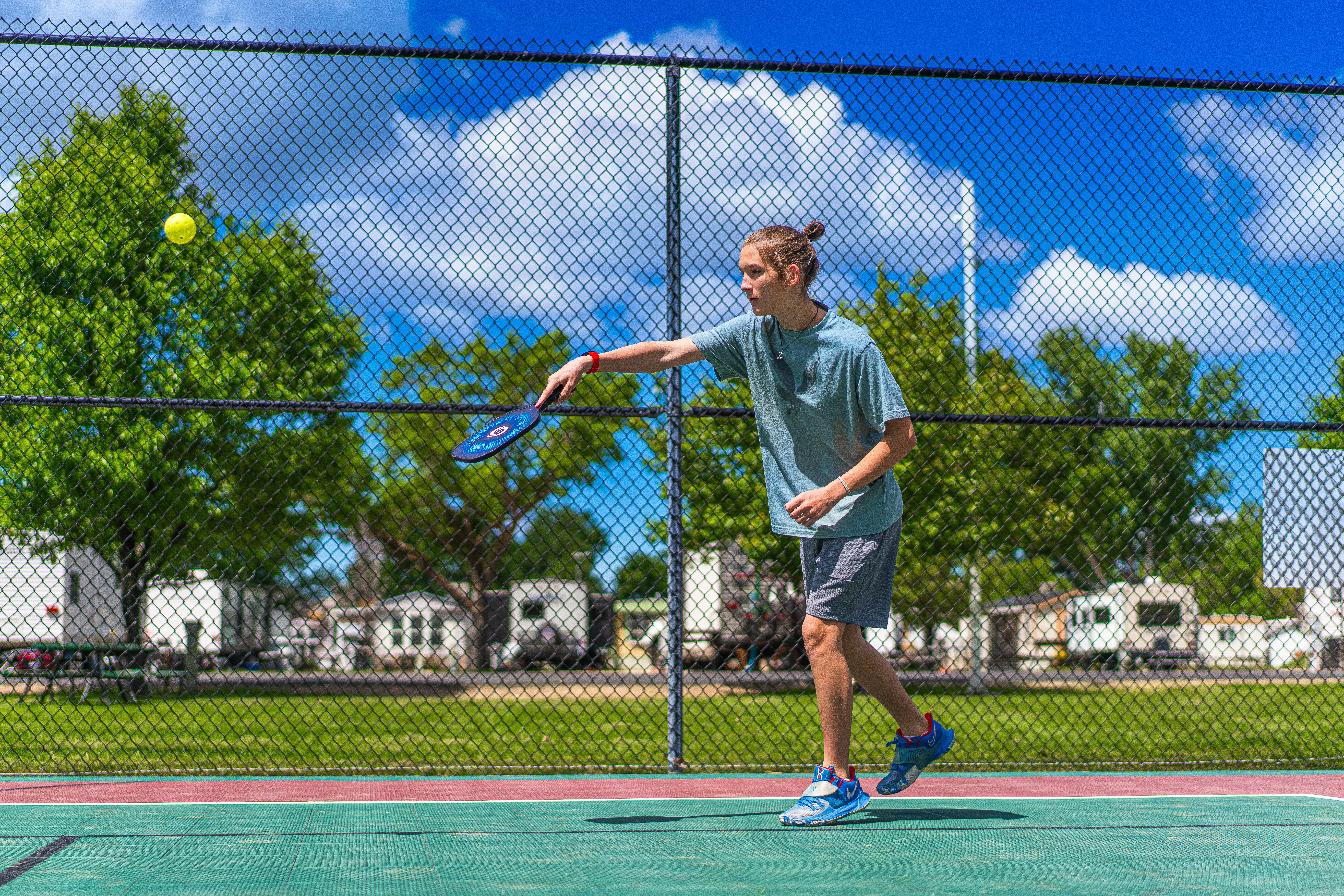 Renee Tilby's son plays pickleball at a campground.