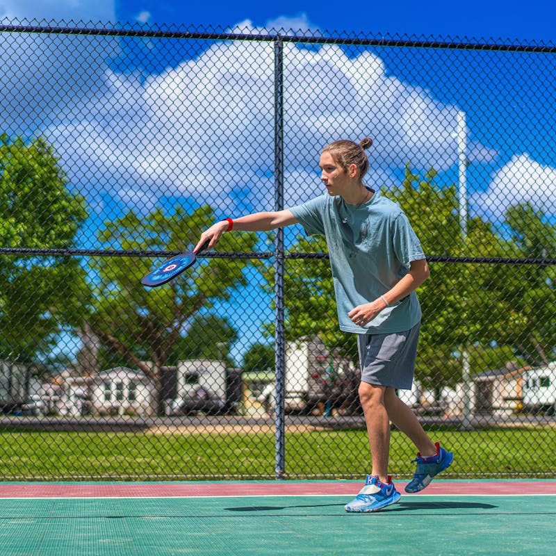 Renee Tilby's son plays pickleball at a campground.
