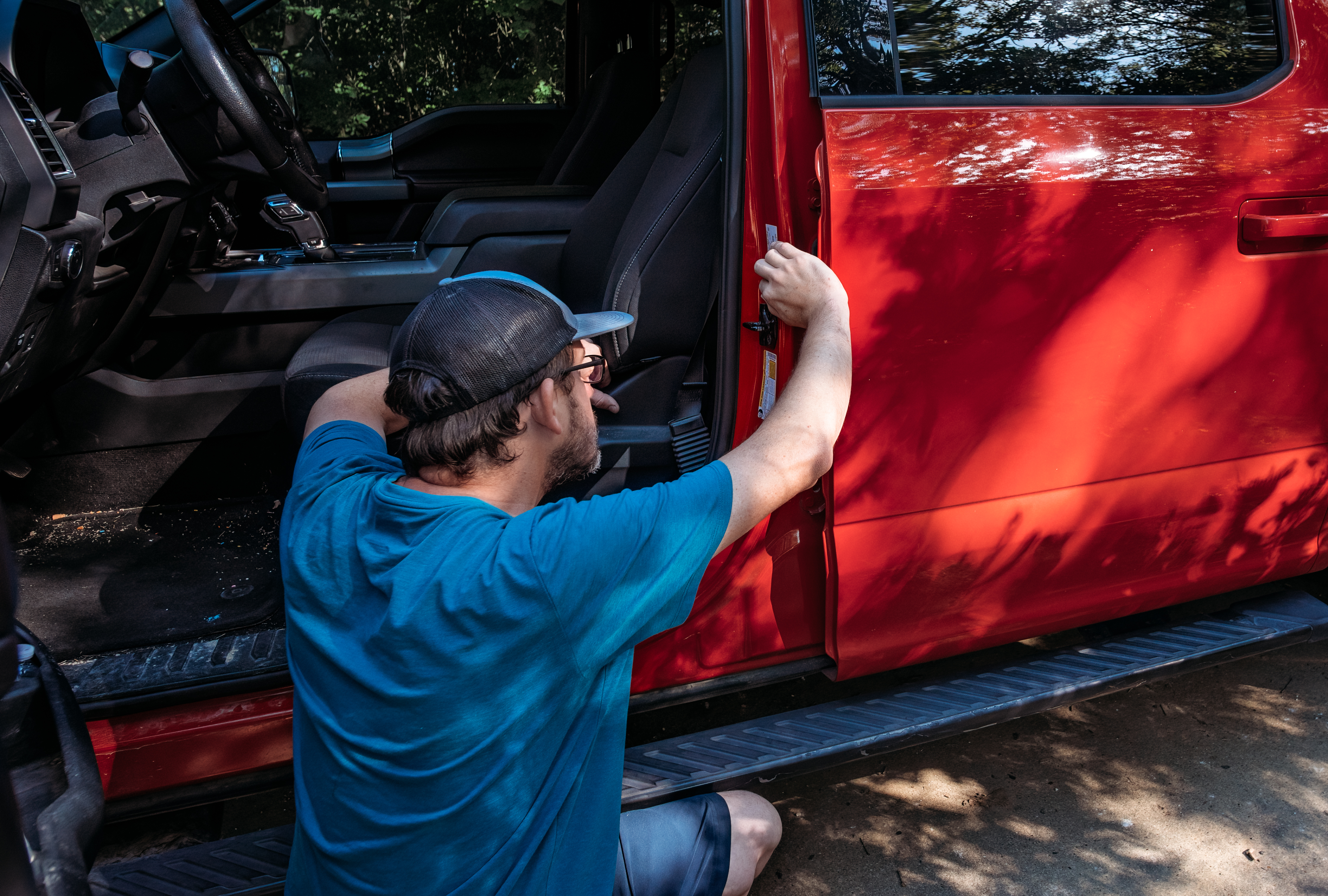 Jason Takacs checks the tow capacity sticker on his truck.