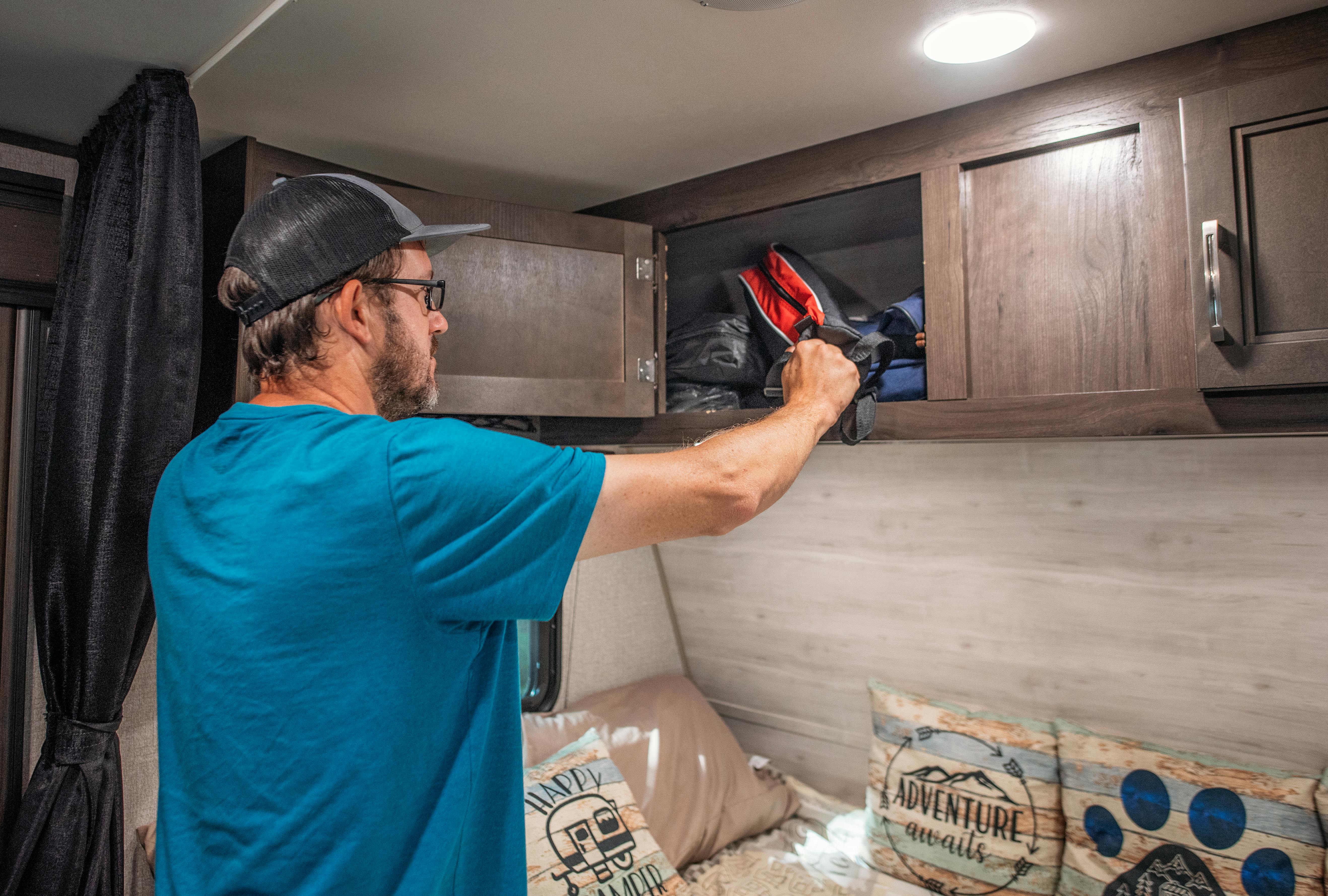 Jason Takacs loads cargo in his Jayco Jay Flight travel trailer.