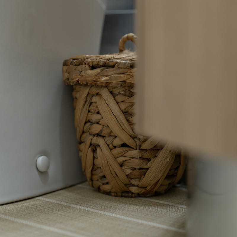 A waste bin in the bathroom.