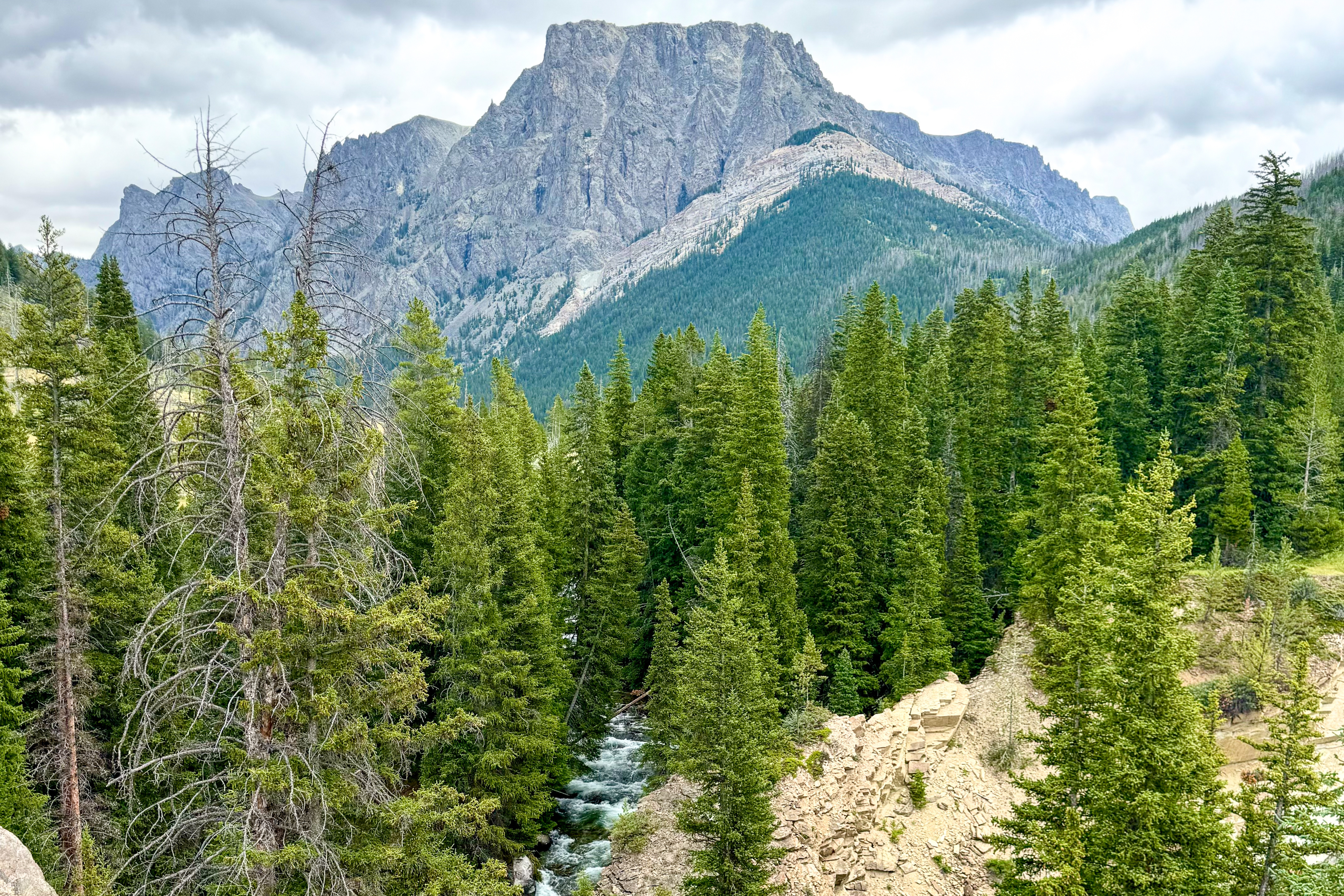 A view of Clear Creek Falls and the mountains in Bridger-Teton National Forest.