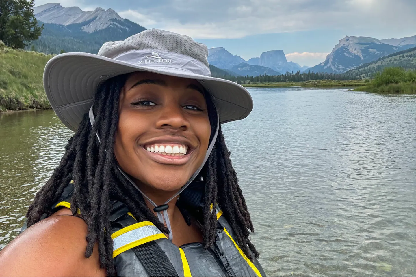 Sherise Gumbs posing in front of the Green River in Bridger-Teton National Forest.