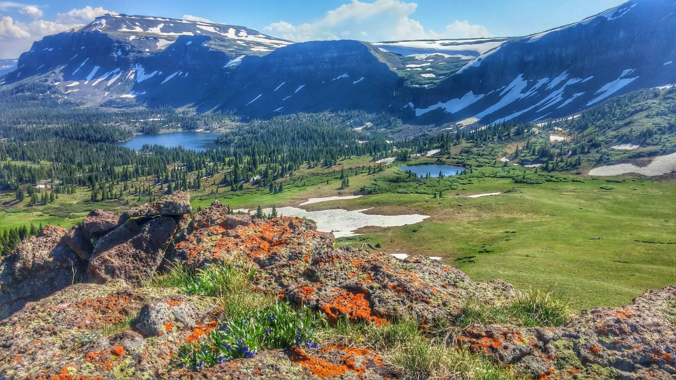 A valley overlooking lakes and mountains in White River National Forest.