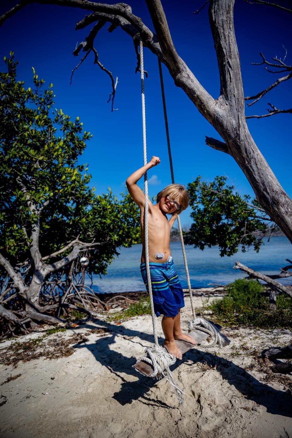 Cassie and Josh Bailey's son on a swing.