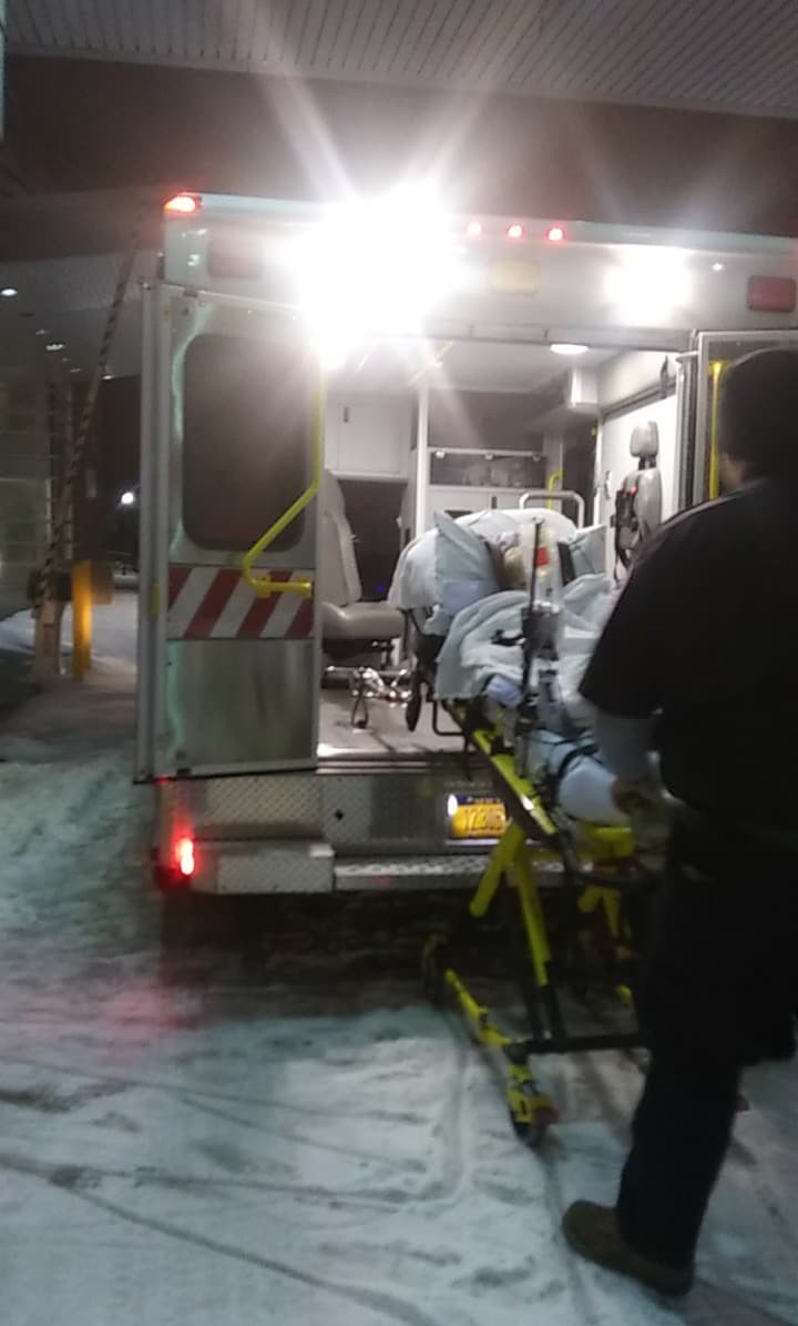 Cassie and Josh Bailey's son being carried into an ambulance. 