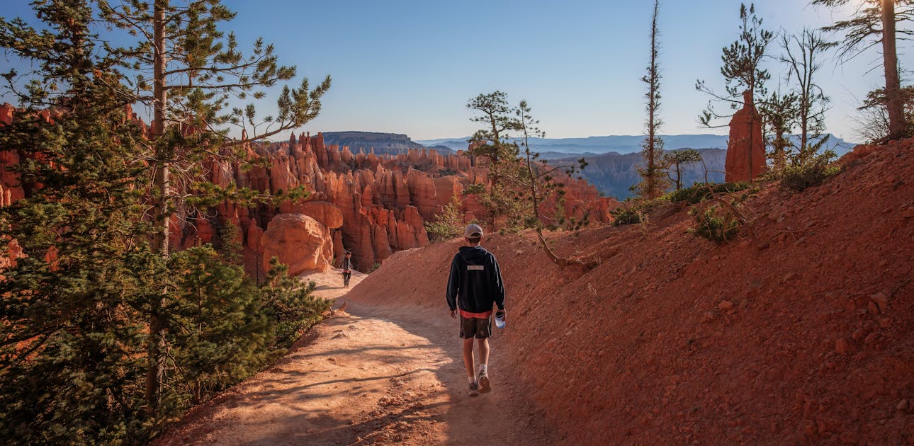 The Takacs family hikes down a dirt trail in Bryce Canyon National Park.