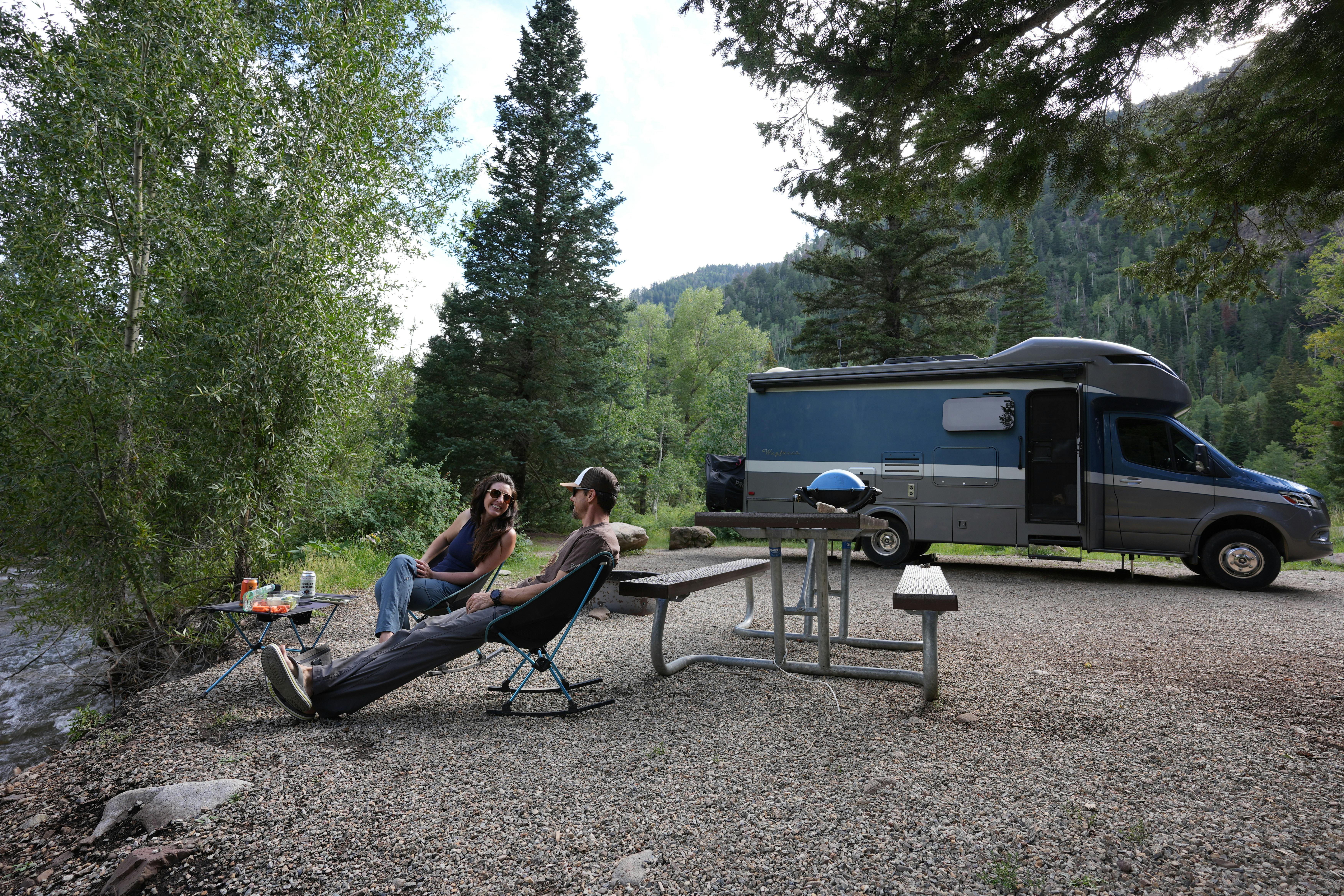 Sarah and Dustin Bauer cook dinner next to the river at Snowslide Campground in San Juan National Forest.