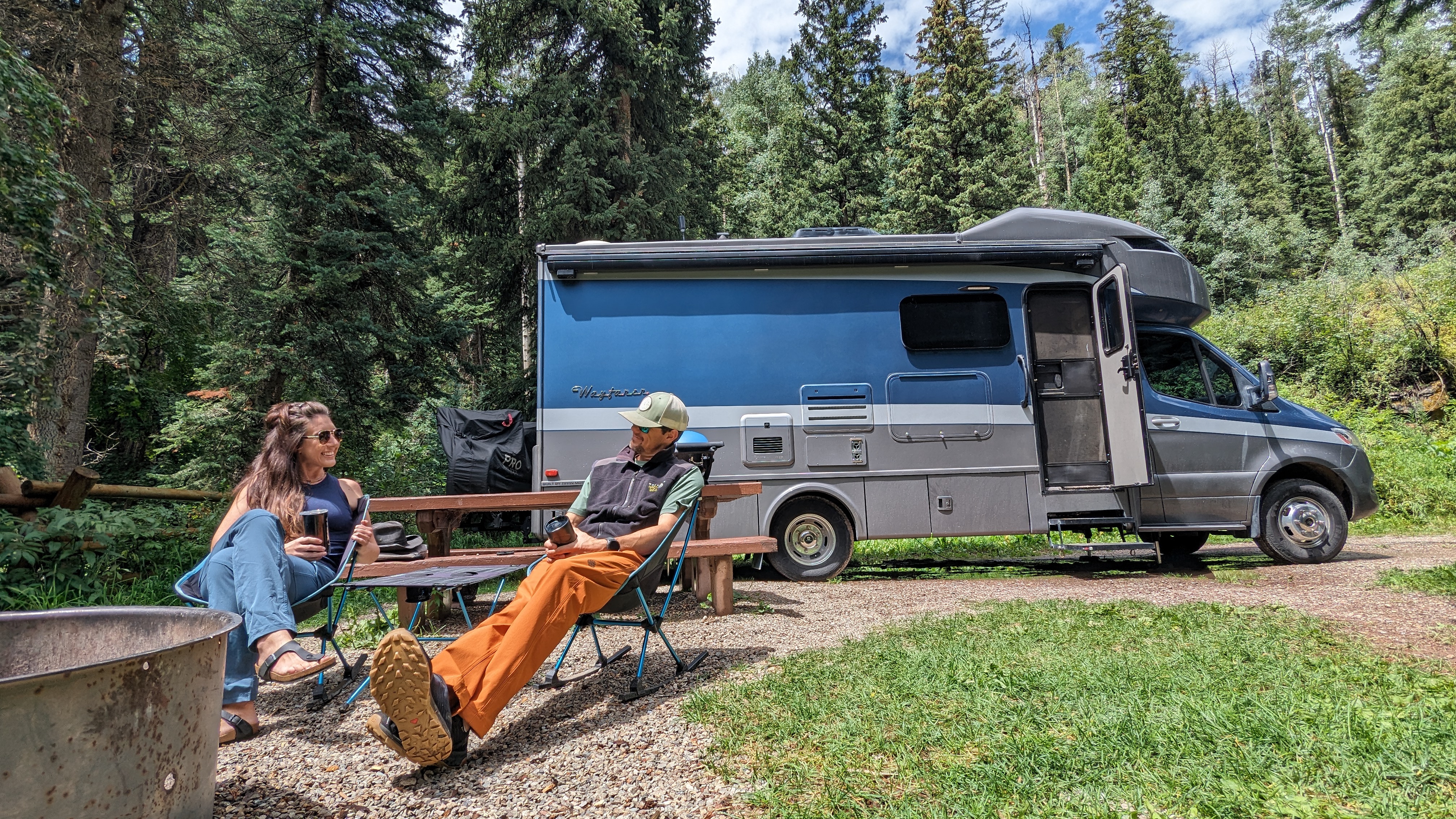 Sarah and Dustin Bauer enjoy coffee outside their Tiffin Wayfarer at Kroeger Campground.