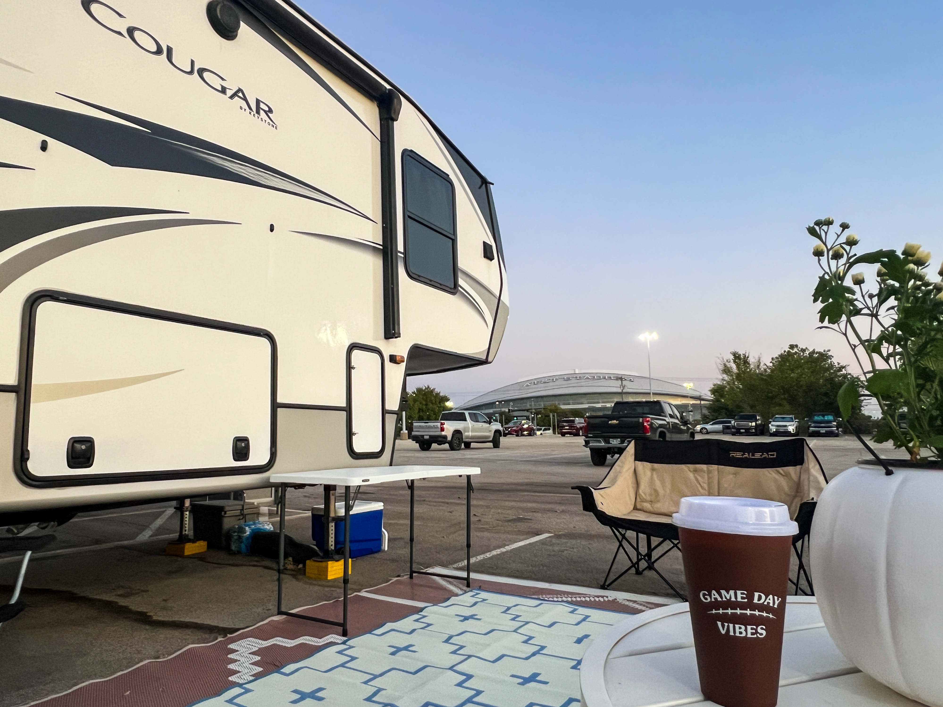 Donny and Tammy Benedict's Keystone Cougar fifth wheel at the stadium parking lot during game day.