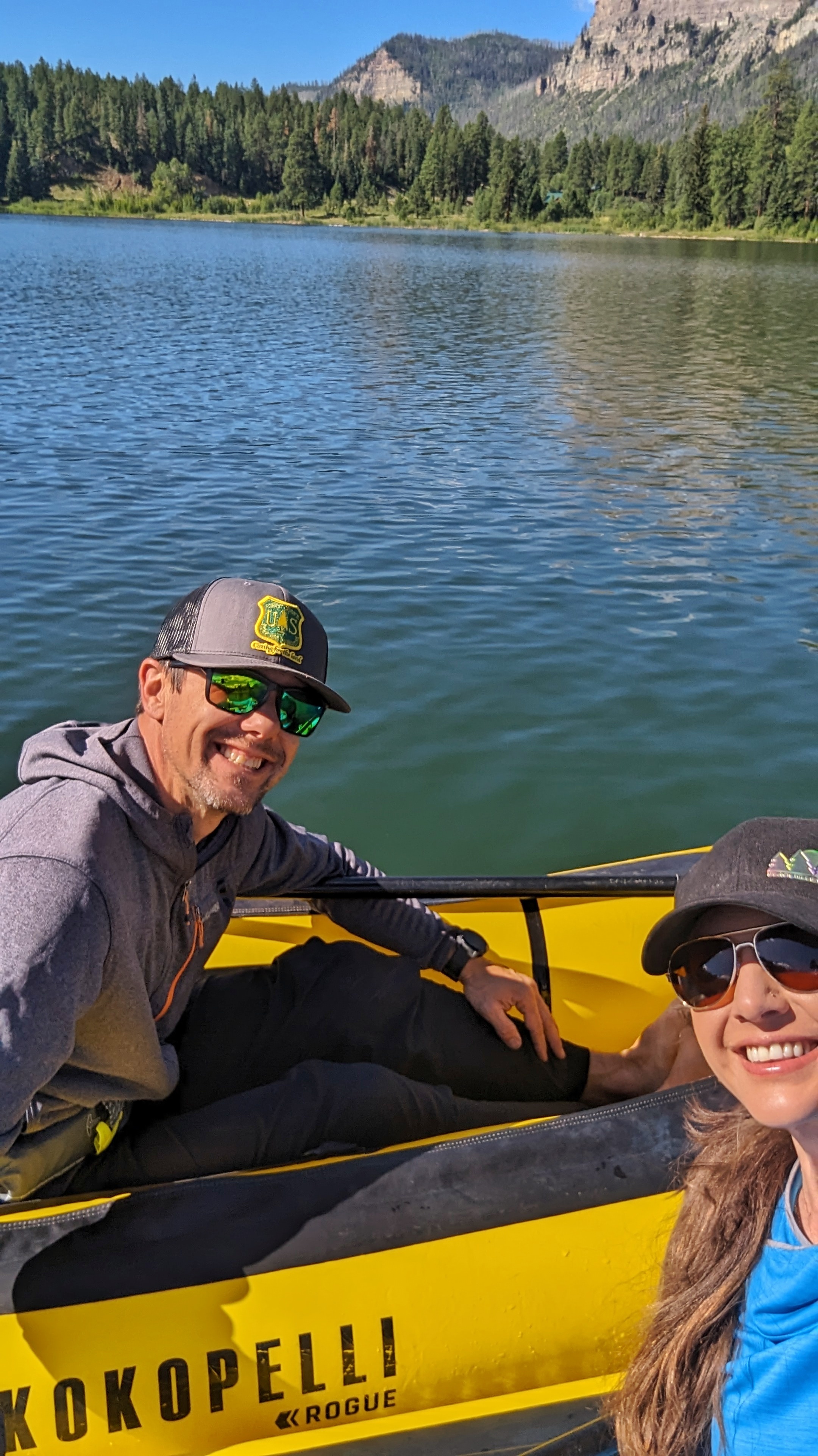 Sarah and Dustin Bauer pose on rafts in San Juan National Forest.