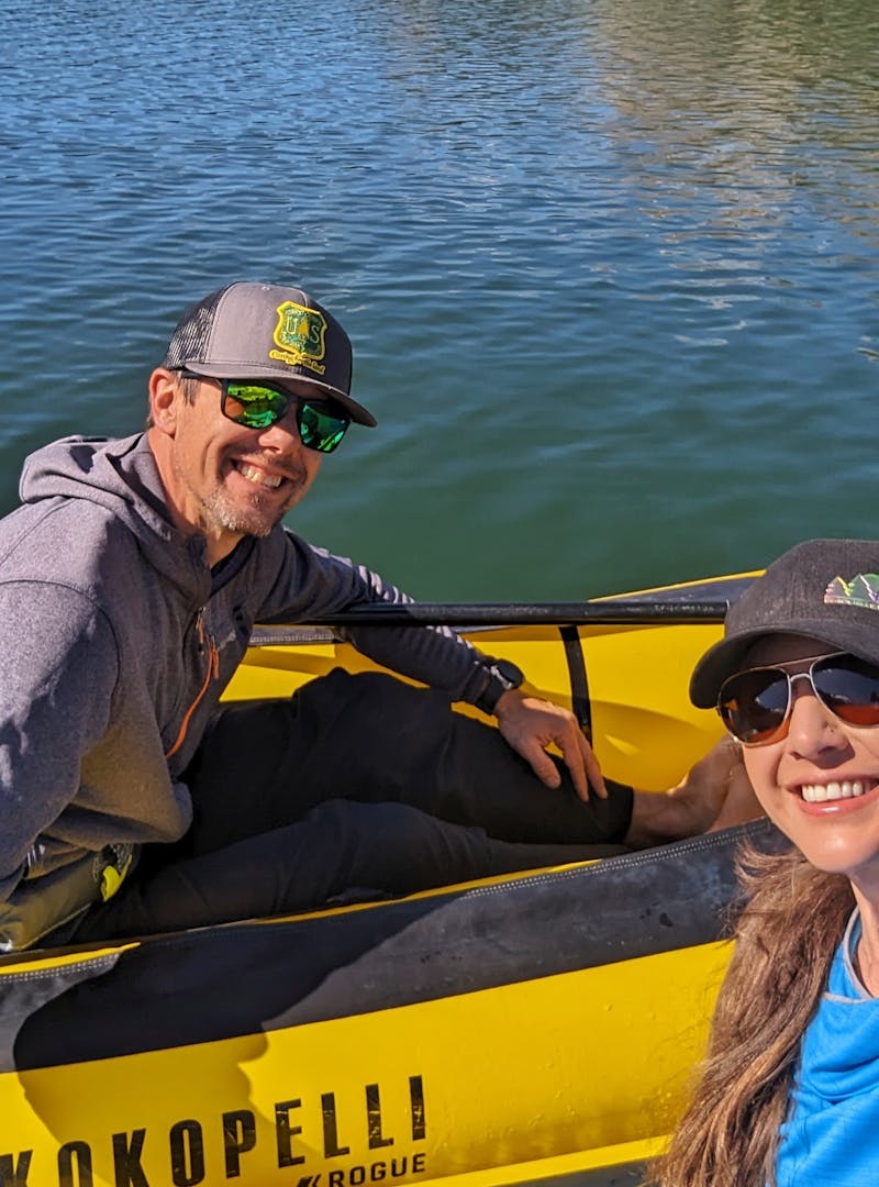 Sarah and Dustin Bauer pose on rafts in San Juan National Forest.