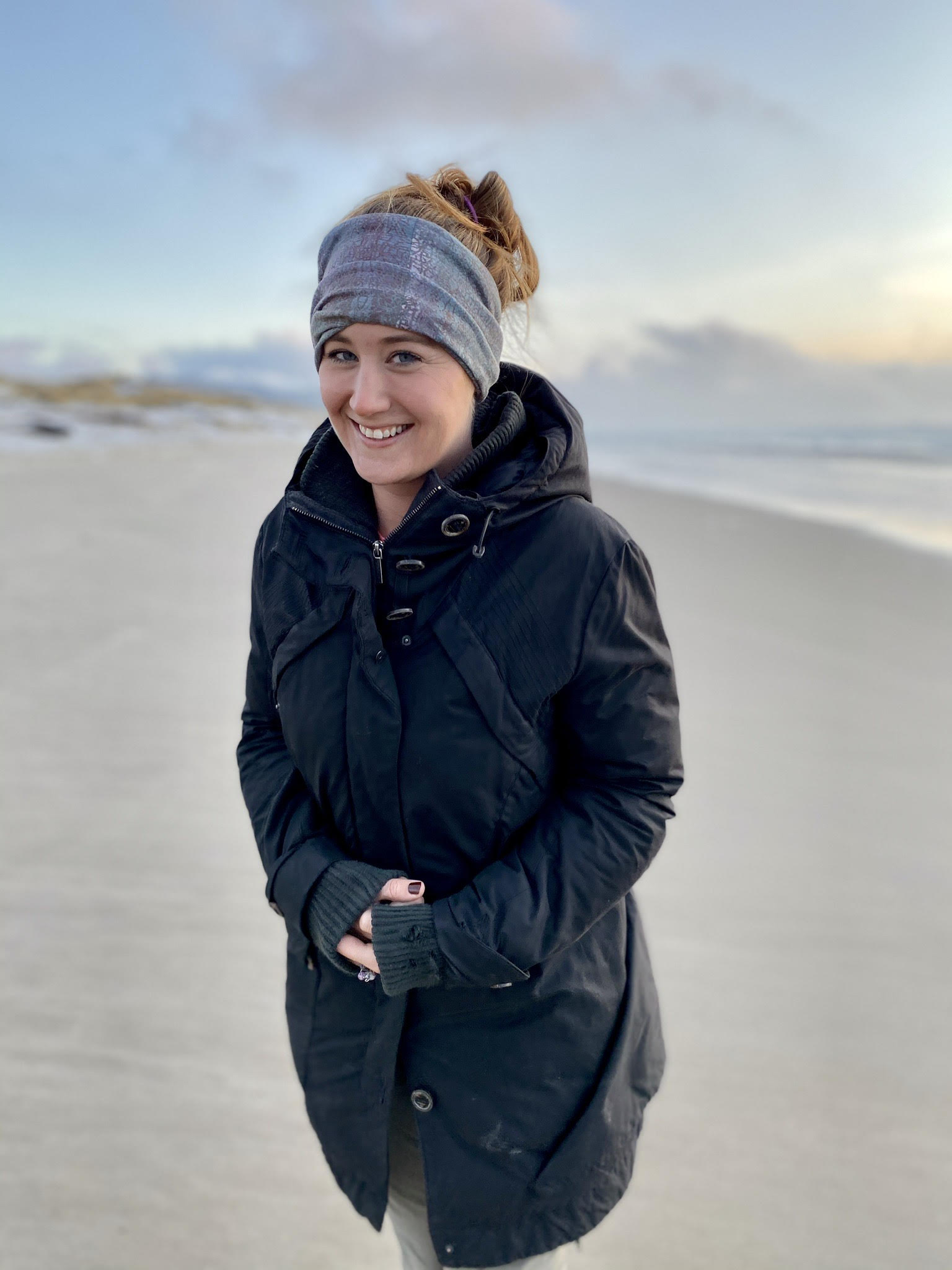 A portrait of Cara Hefty on the beach. 