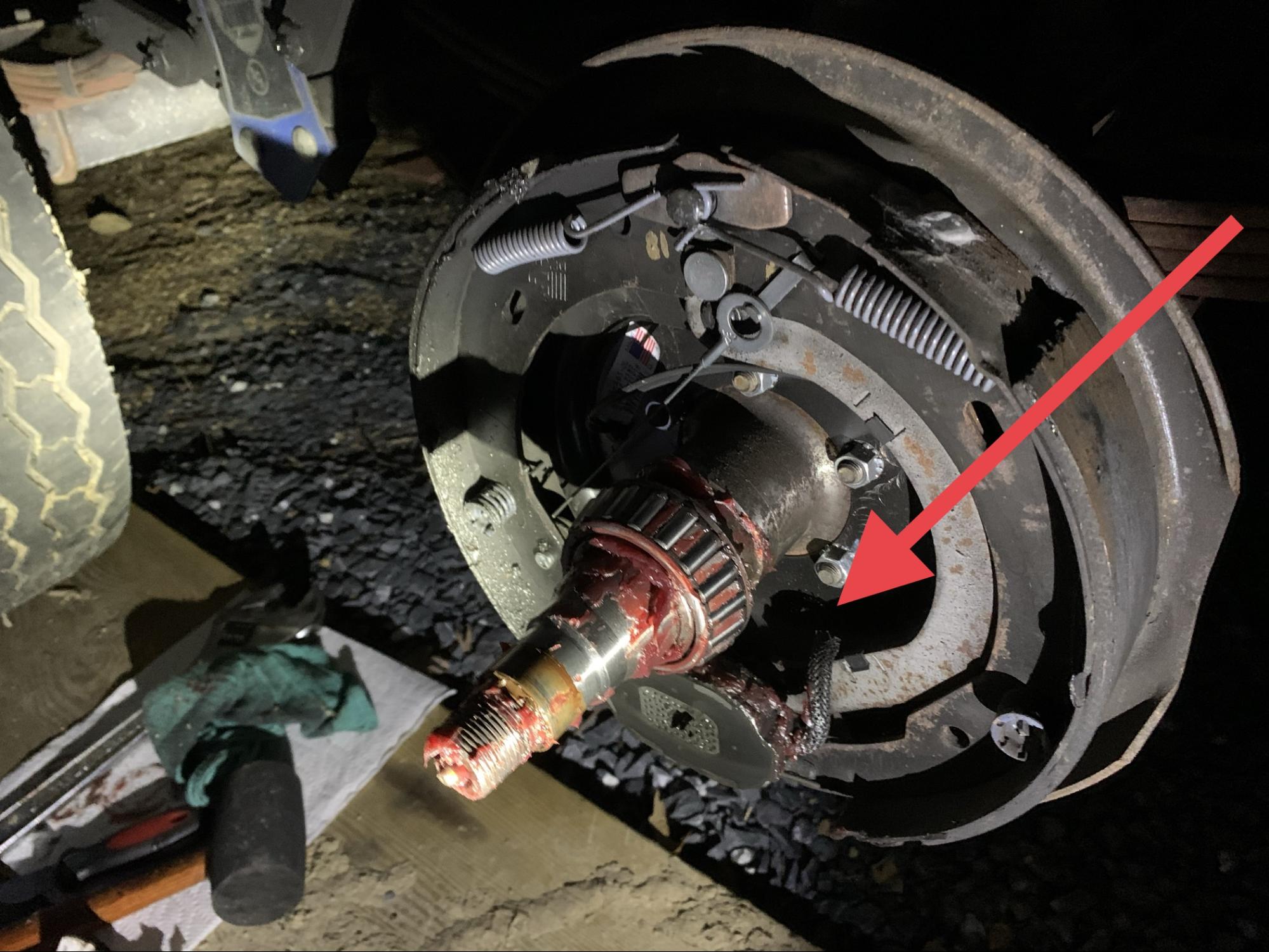 Tom Boswell showing grease that contaminated his break system.