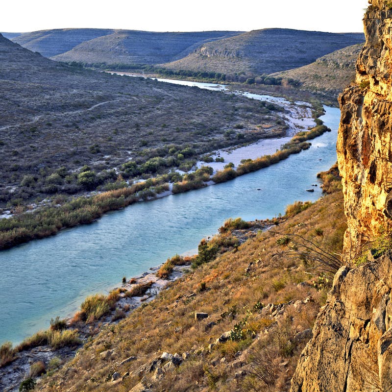 A shot of Devils River winding across the landscape in golden light. 