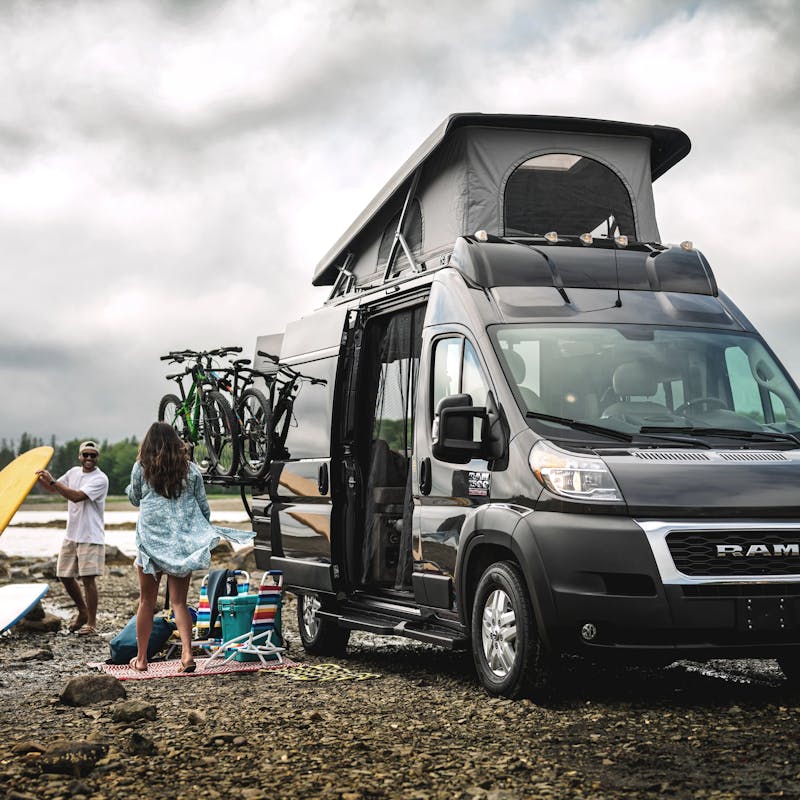 A couplet sets up camp outside of a Thor Motor Coach Scope Class B Camper Van