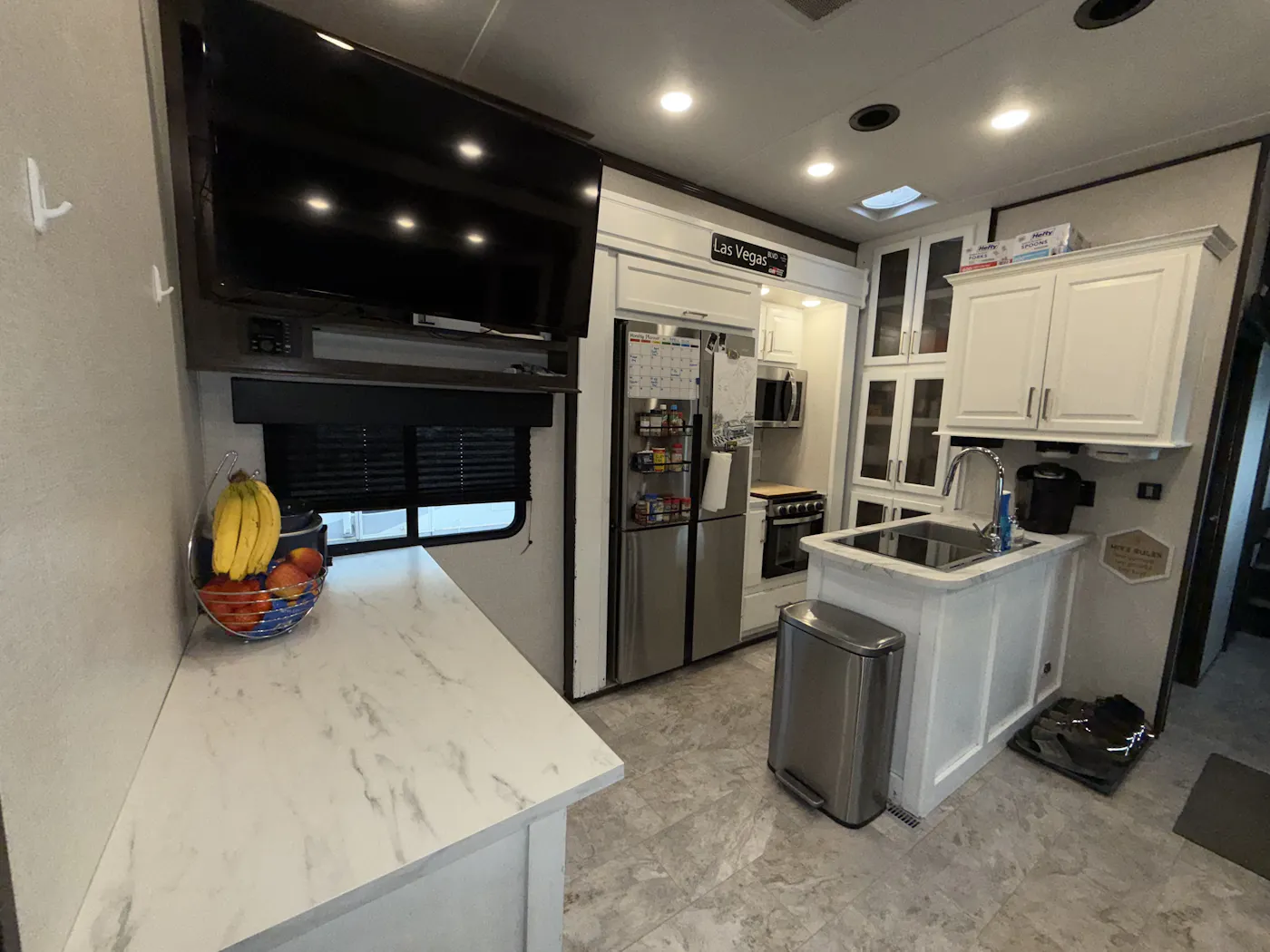 Kitchen with white marble countertops in the Dutchmen Voltage Triton