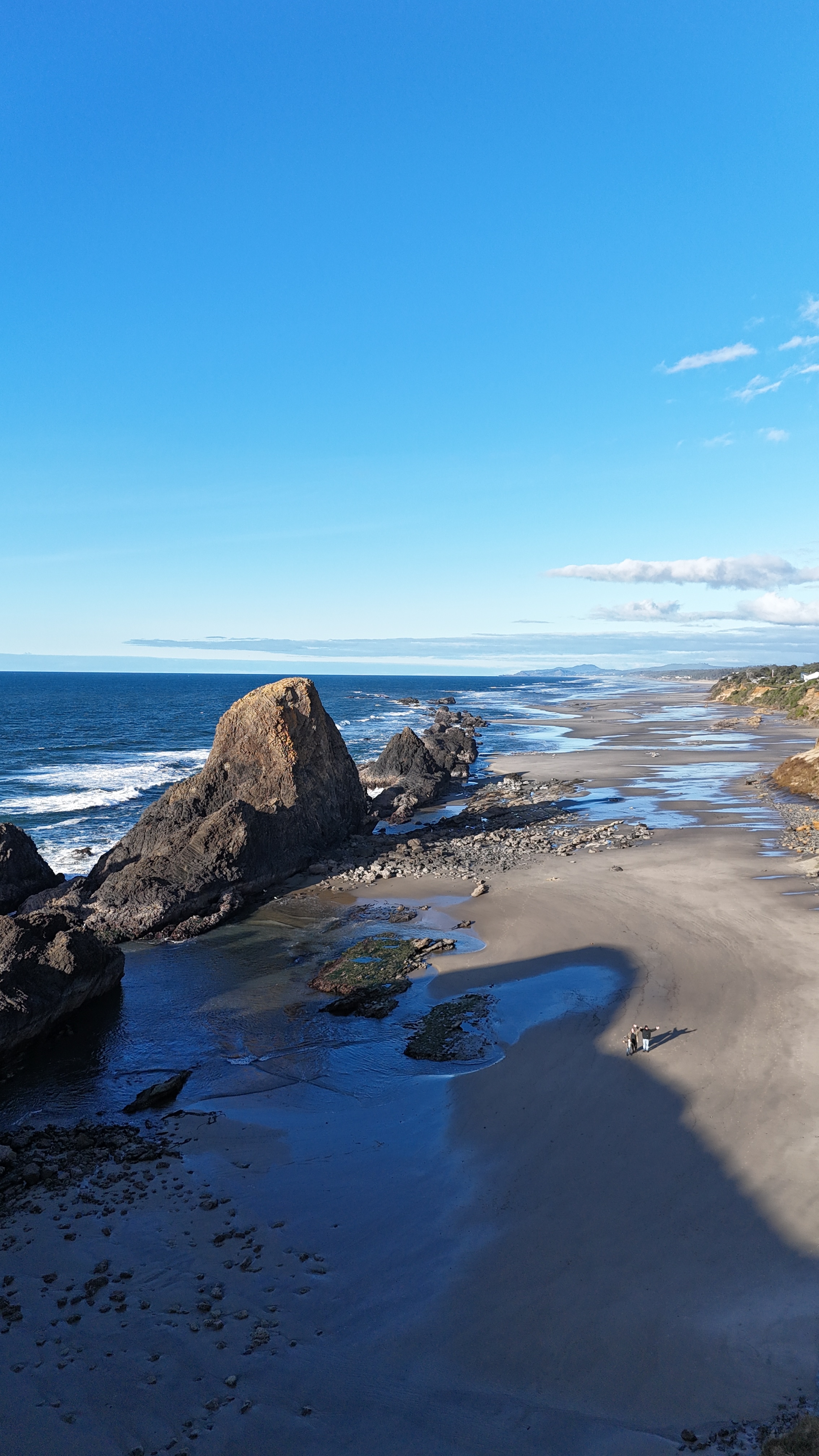 West Coast beach with rocky cliff