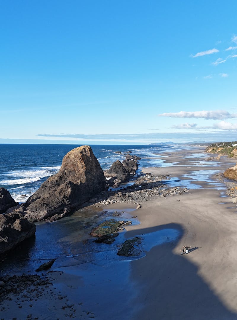 West Coast beach with rocky cliff