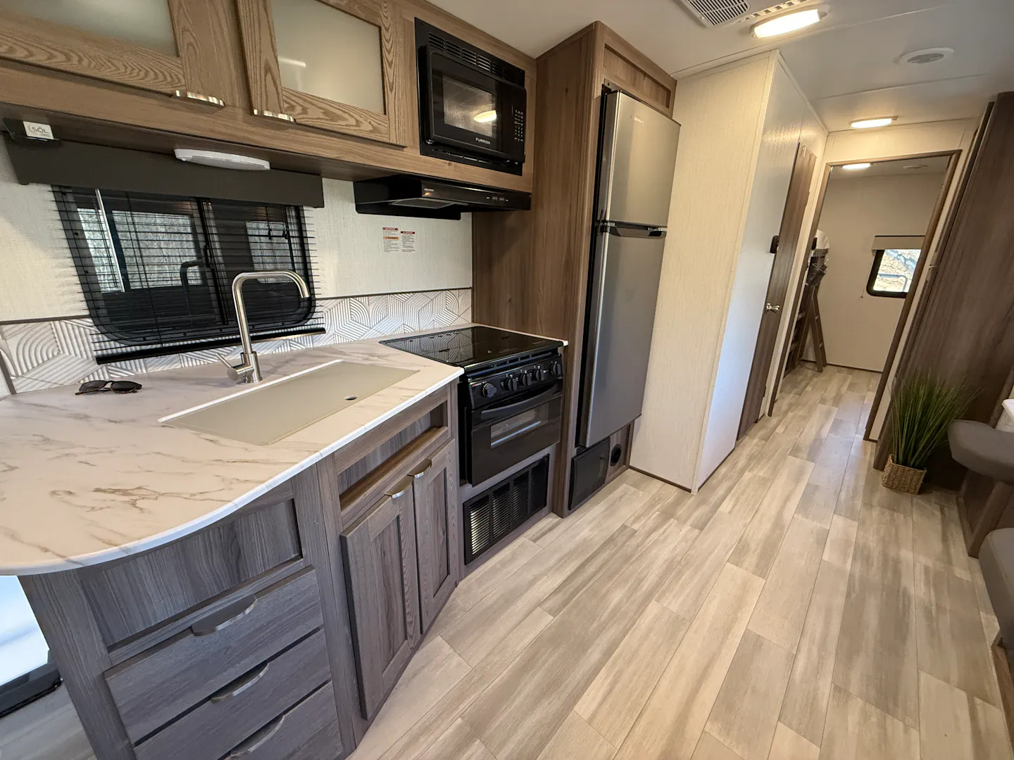 kitchen and galley of a cruiser mpg travel trailer 