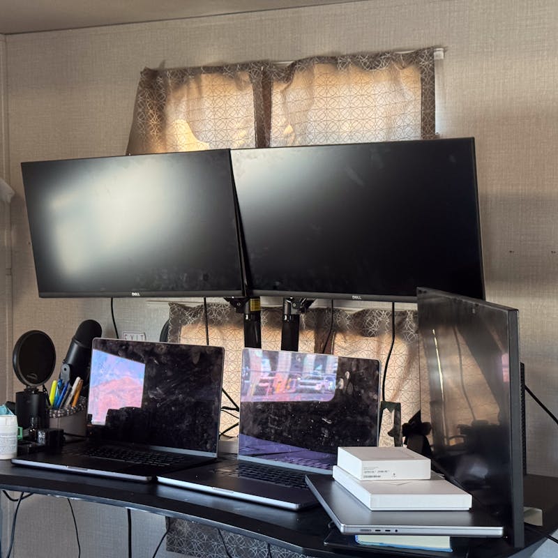 A four-monitor work from home desk in an RV