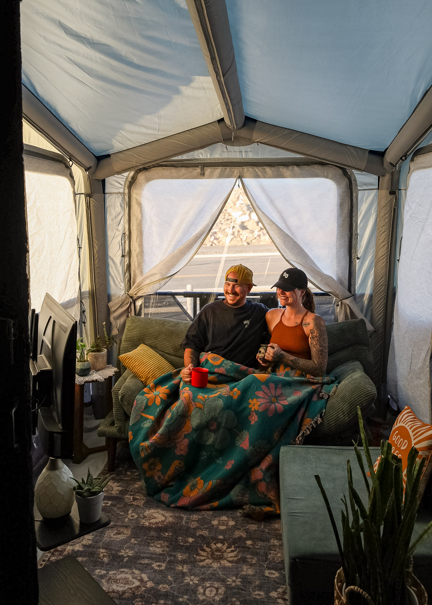 Kearstin and David Saul in their enclosed porch tent off their toy hauler patio 
