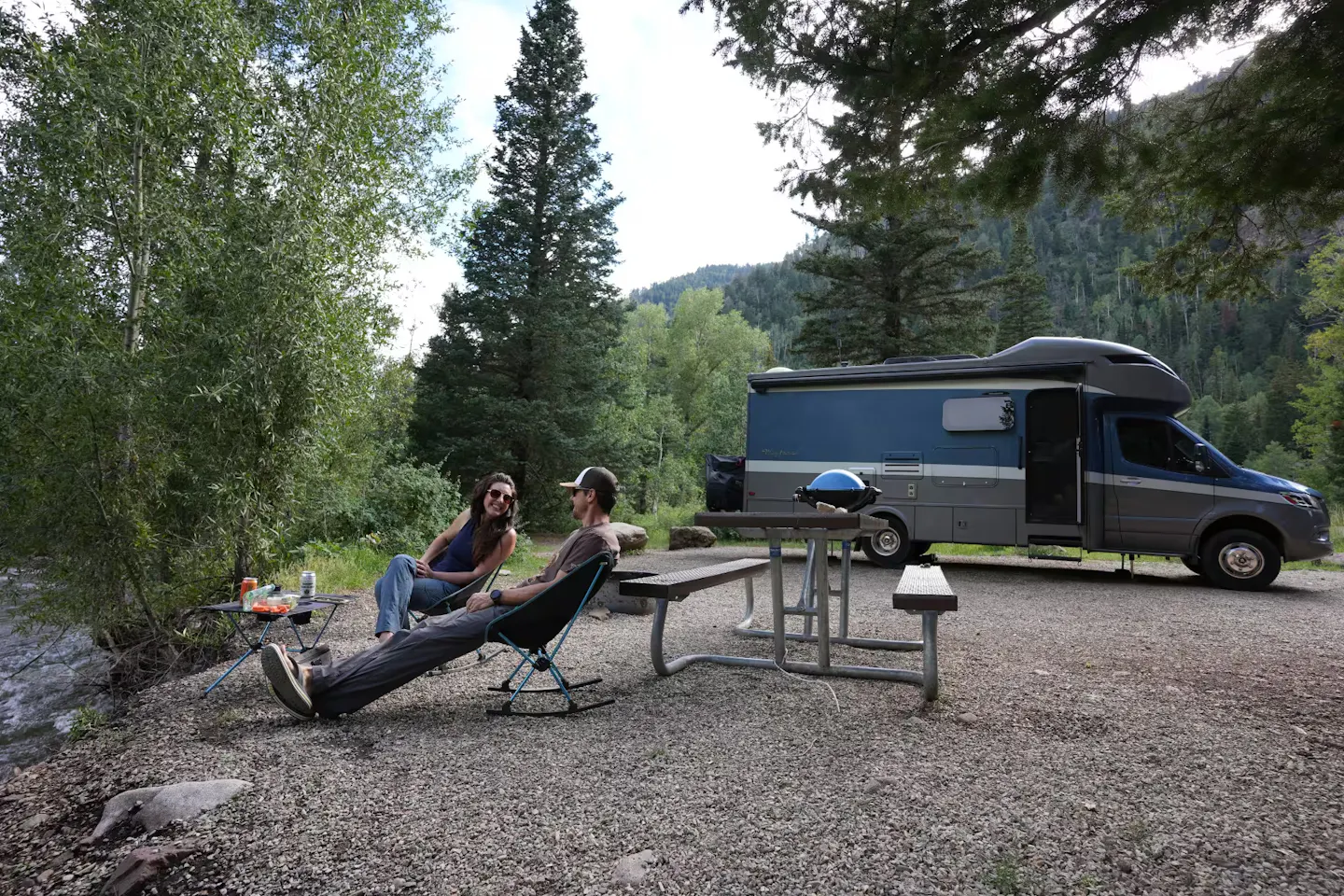 Sarah and Dustin Bauer cook dinner next to the river at Snowslide Campground in San Juan National Forest.