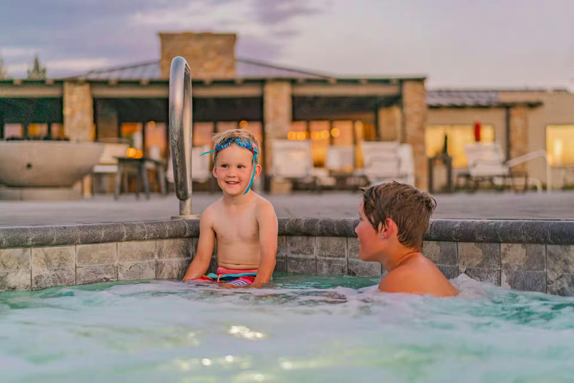 Renee Tilby's kids sit in a hot tub at a campground.