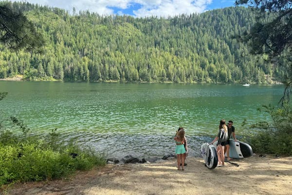 Ashley Peeples and her family get ready to paddleboard on Lake Pend Oreille.