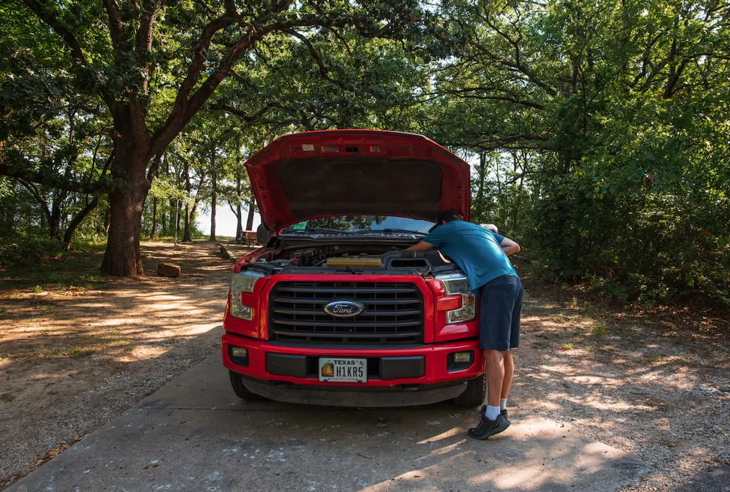 Jason Takacs does maintenance on his truck.