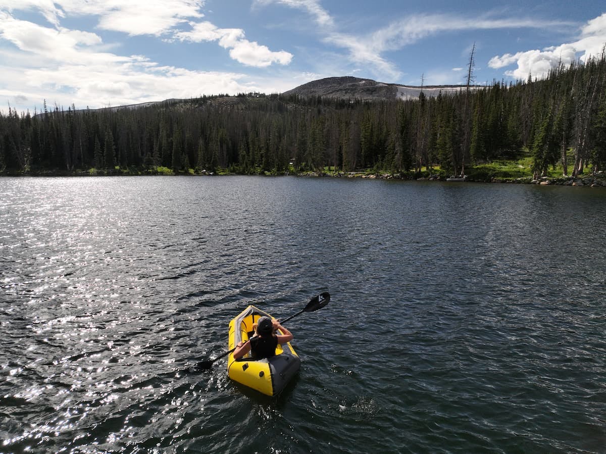 Sarah Bauer packrafting in Brooklyn Lake in Medicine Bow Routt National Forest.