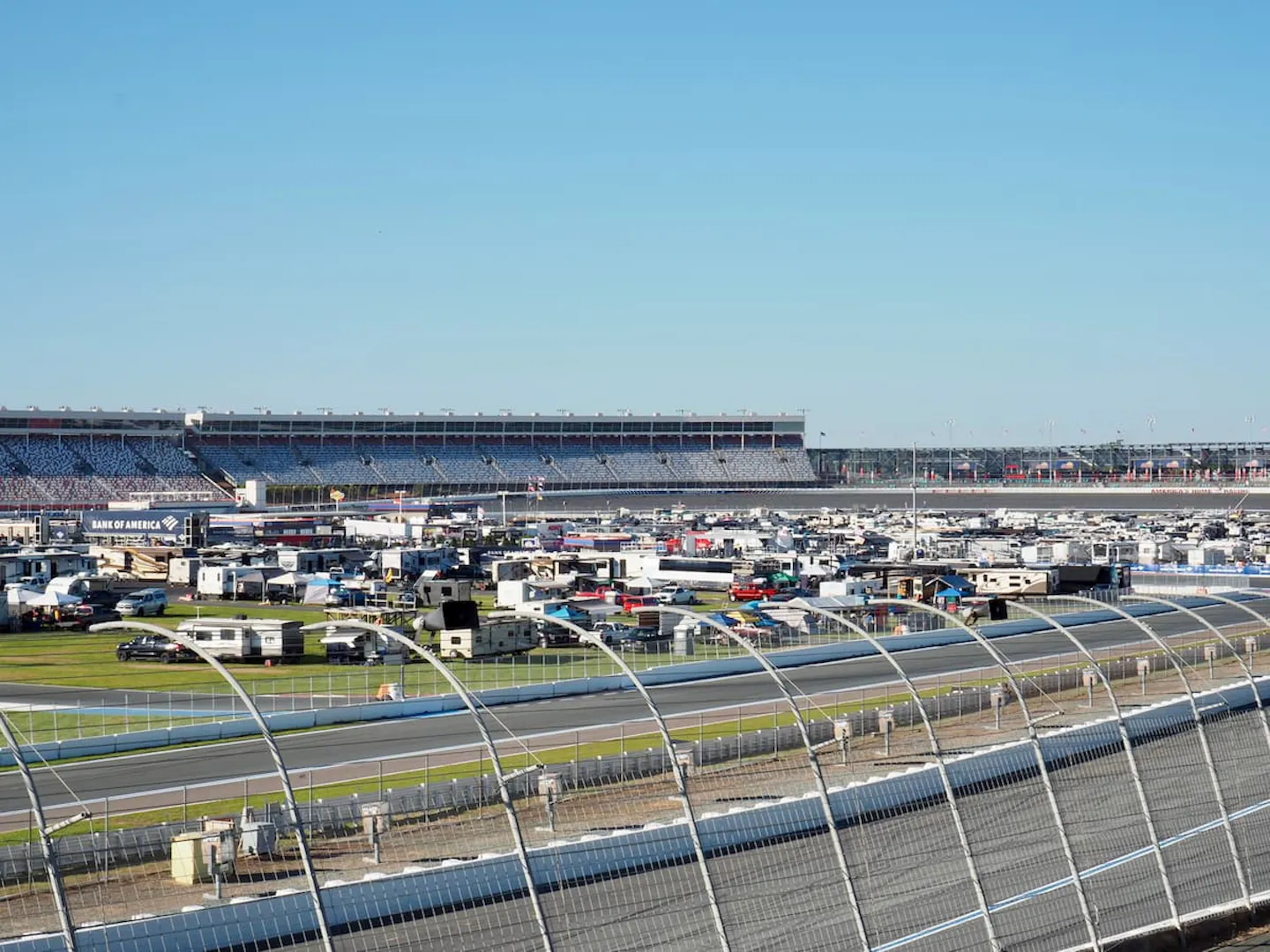 A view of the racetrack and infield RV camping at the Charlotte Motor Speedway in the day.