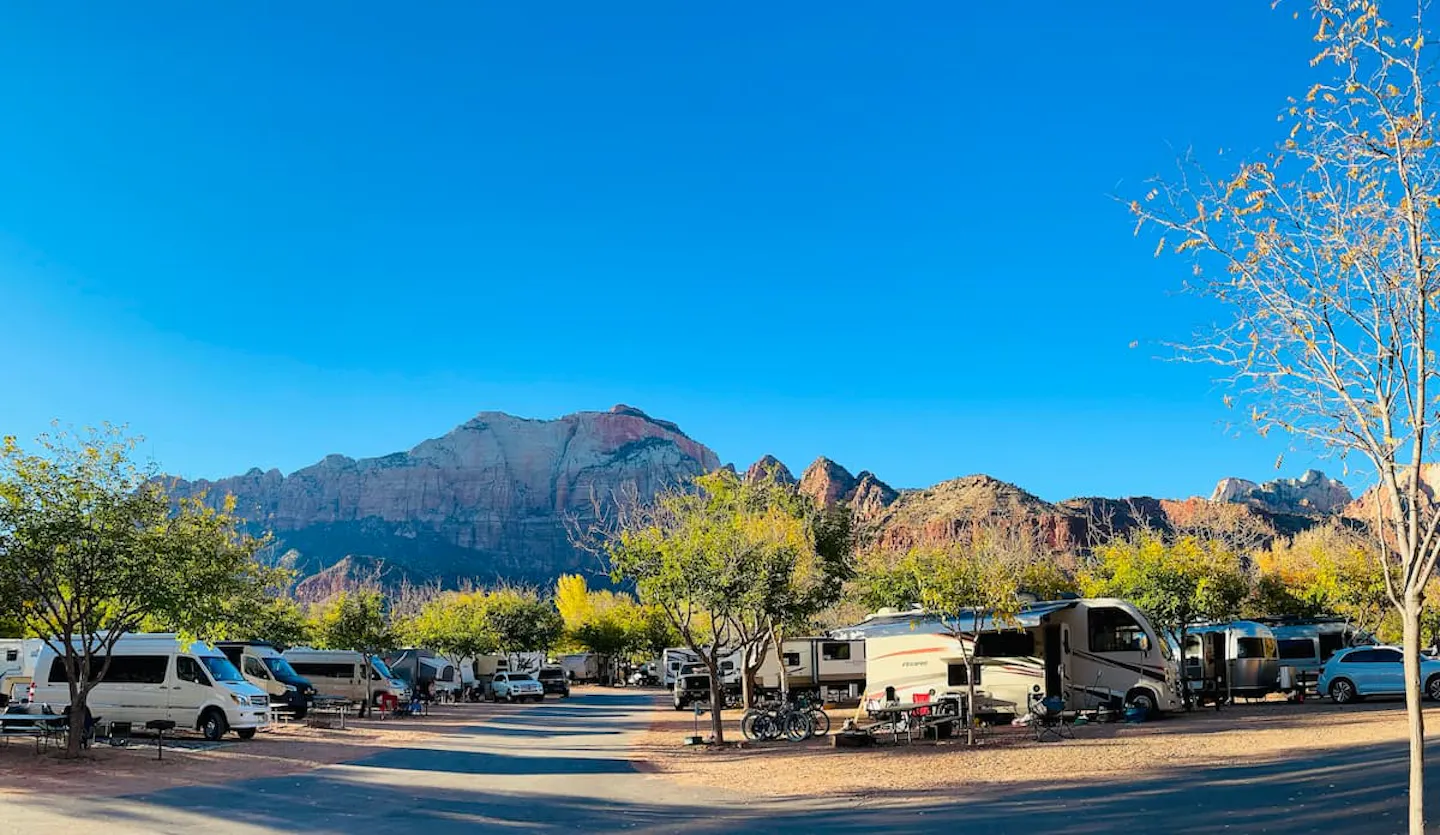 Brenda and Tiger's Thor Motor Coach vegas at a campground.