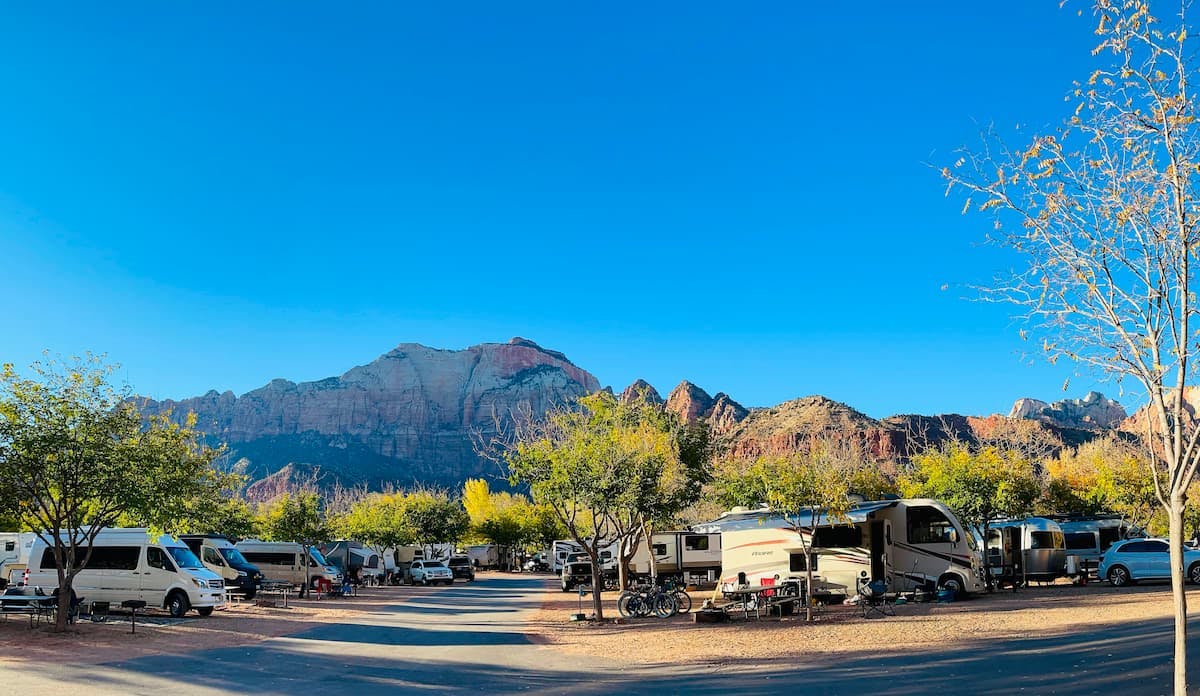 Brenda and Tiger's Thor Motor Coach vegas at a campground.