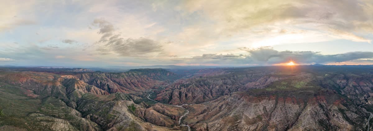 A panoramic photo of mountain ranges in Kaibab National forest by Jeff Poe.