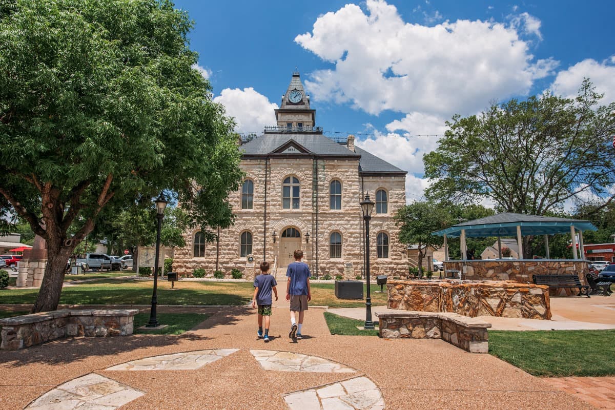 Alison Takacs children walking around Glen Rose, Texas.